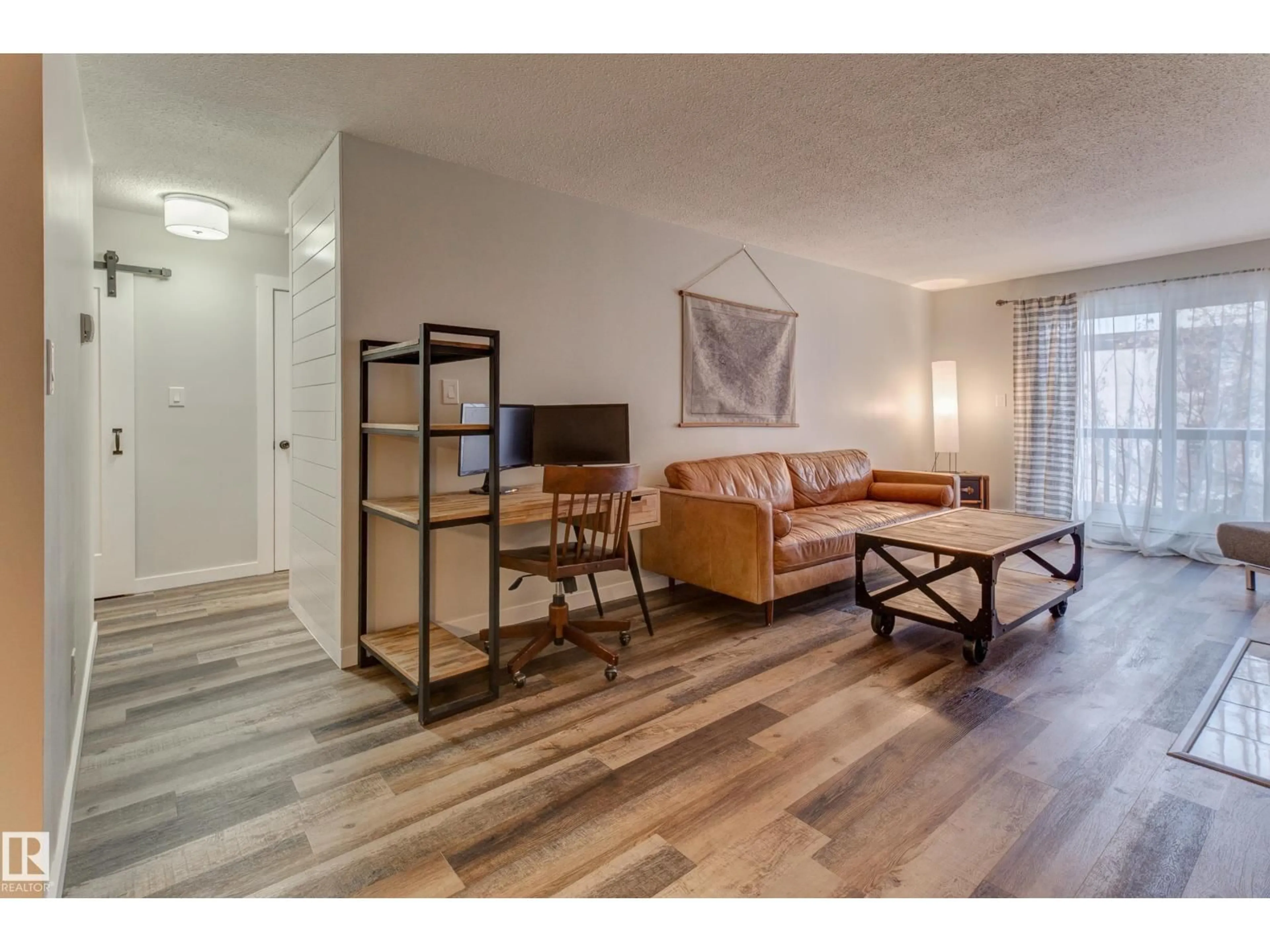 Living room with furniture, wood/laminate floor for #404 - 10420 93 ST NW, Edmonton Alberta T5H1X4