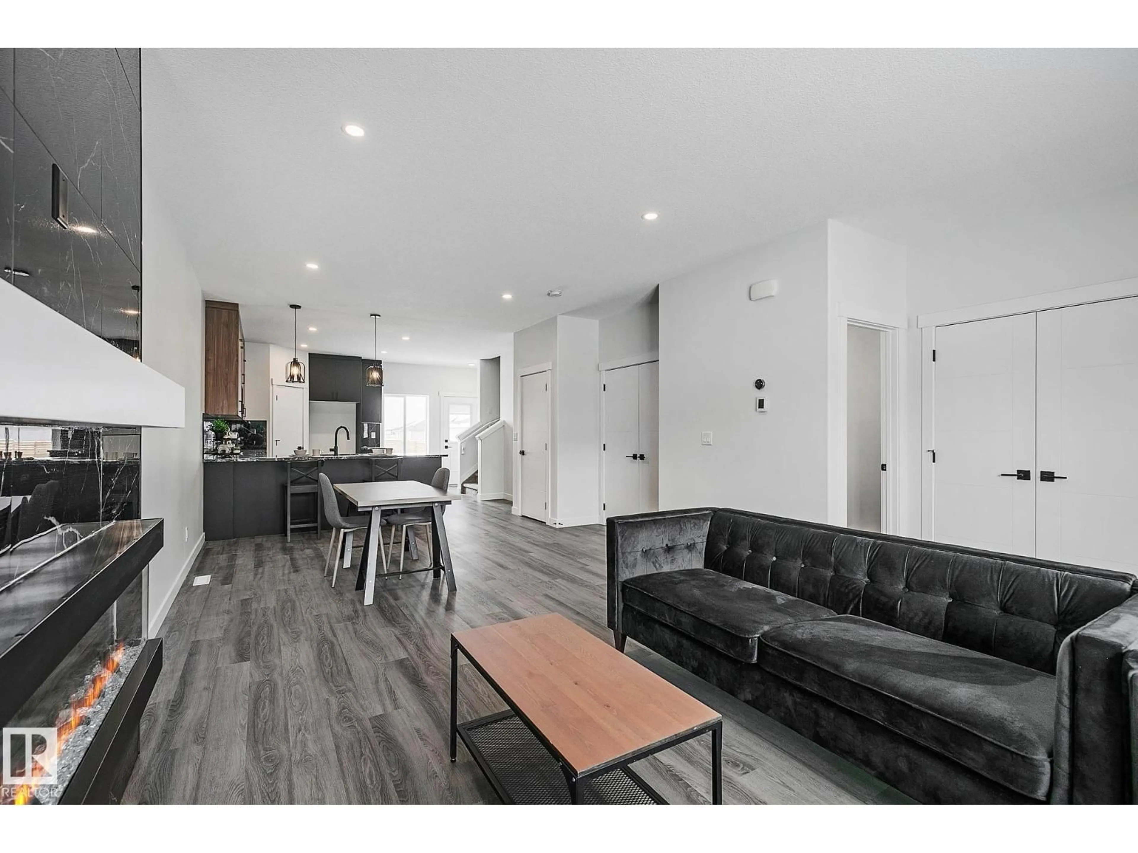 Open concept kitchen, wood/laminate floor for 9831 107A AVENUE, Morinville Alberta T8R2P1