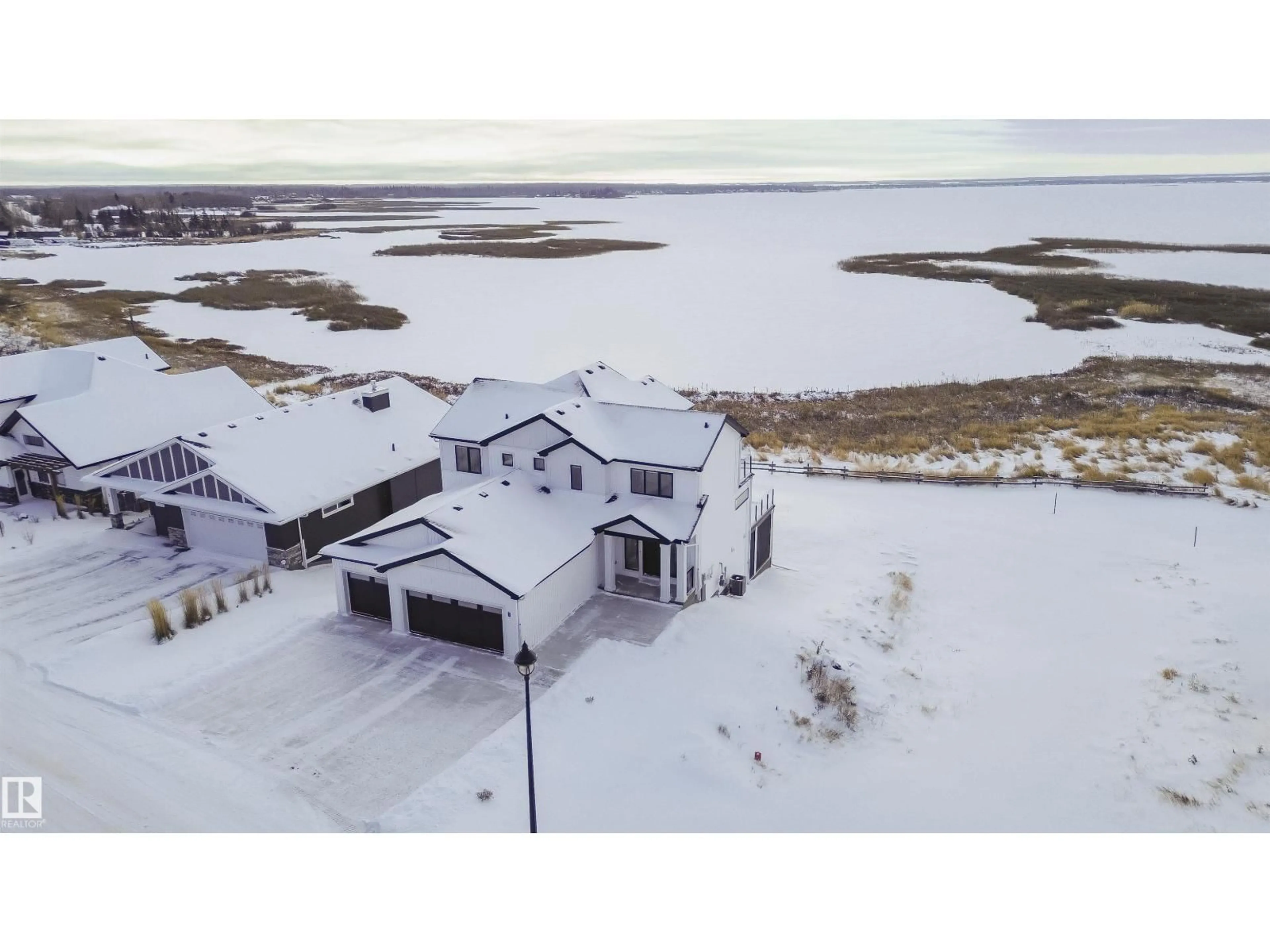 A pic from outside/outdoor area/front of a property/back of a property/a pic from drone, water/lake/river/ocean view for STE - 7 ANNE TR, Rural Lac Ste. Anne County Alberta T0E1A1