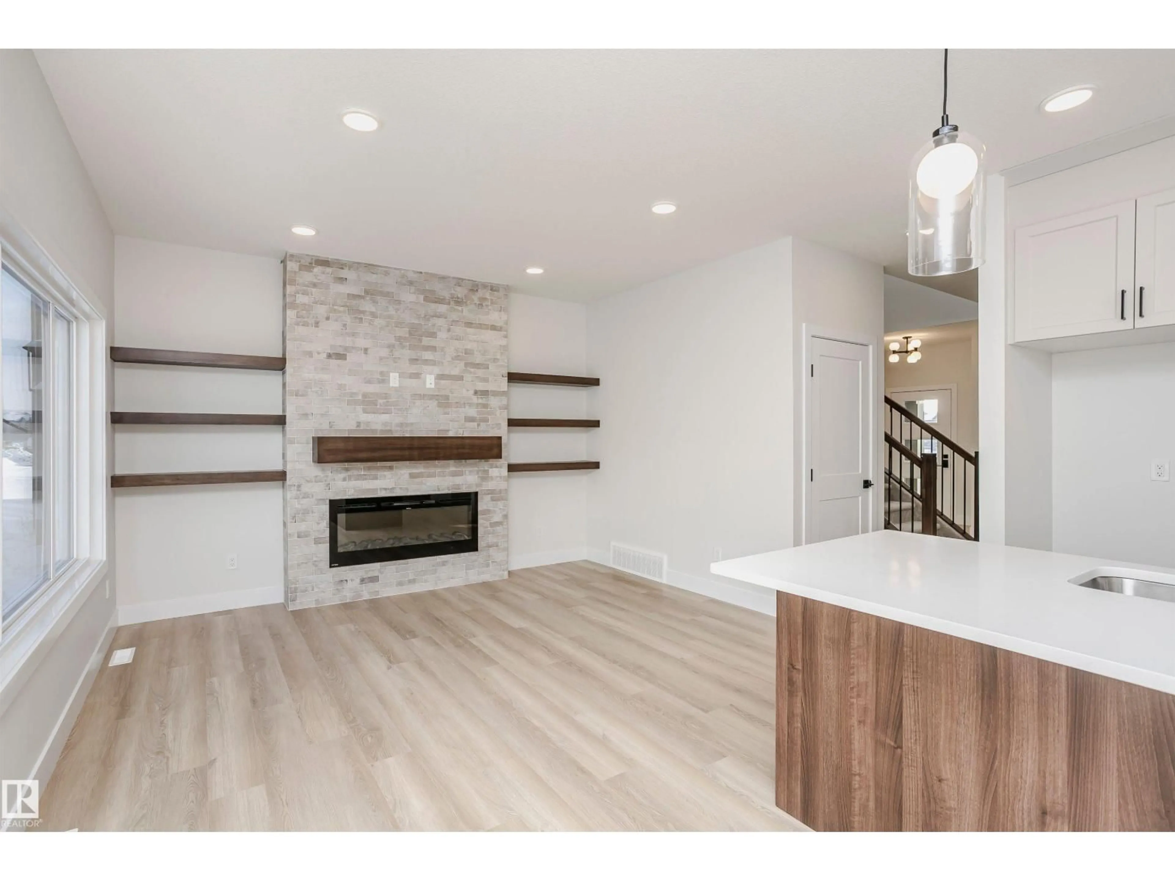 Open concept kitchen, wood/laminate floor for 6302 DANSEREAU CR, Beaumont Alberta T4X3E1