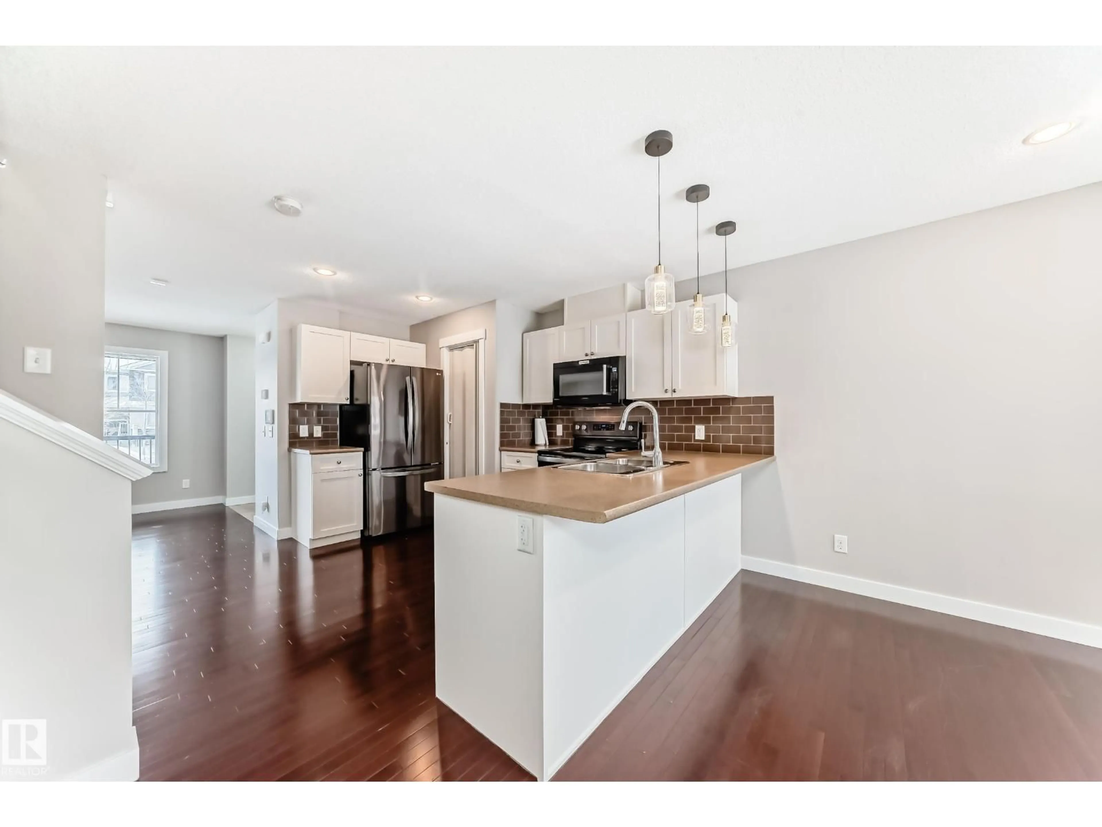 Open concept kitchen, wood/laminate floor for 512 CHAPPELLE DR, Edmonton Alberta T6W2B4