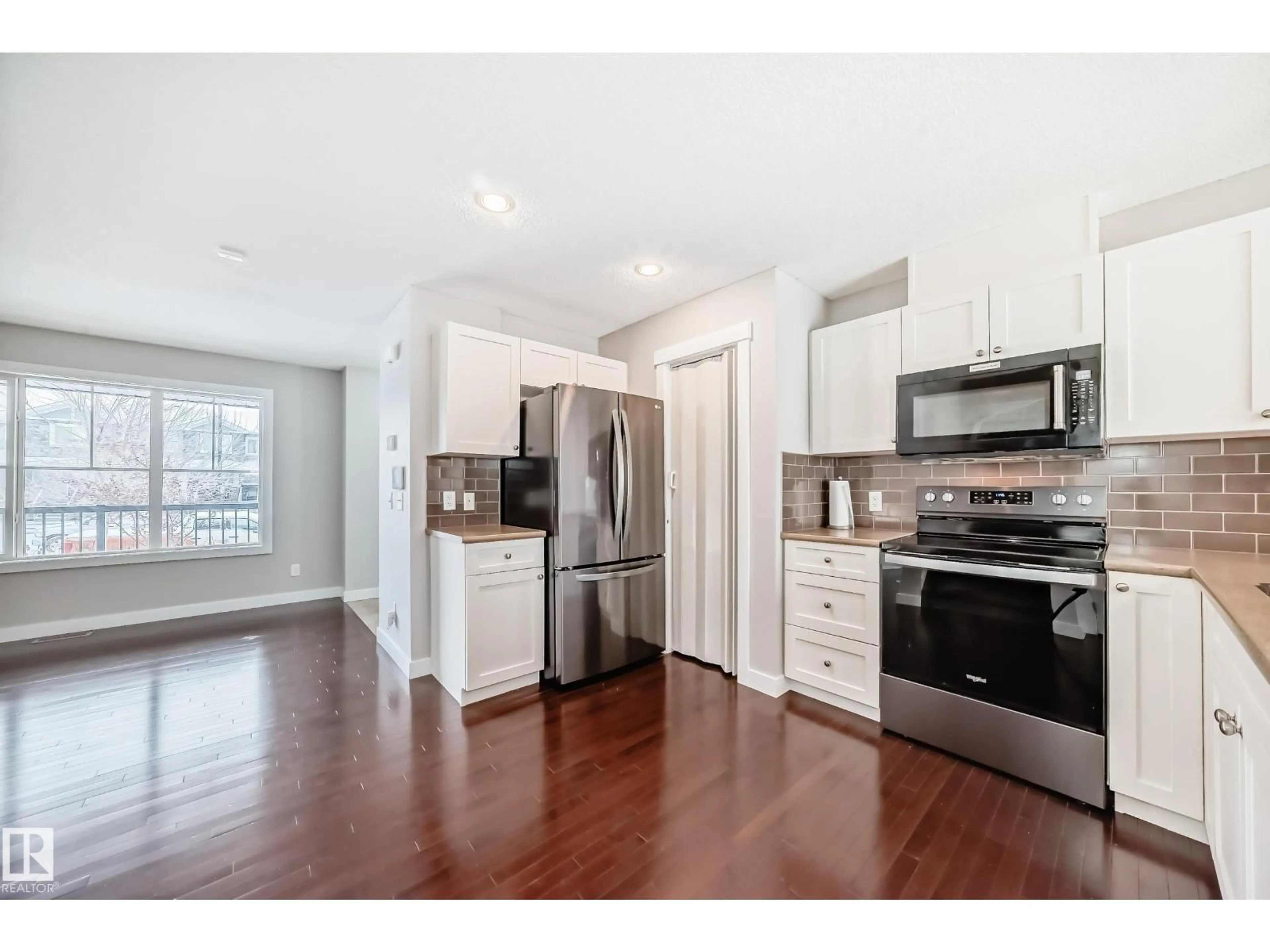 Open concept kitchen, wood/laminate floor for 512 CHAPPELLE DR, Edmonton Alberta T6W2B4