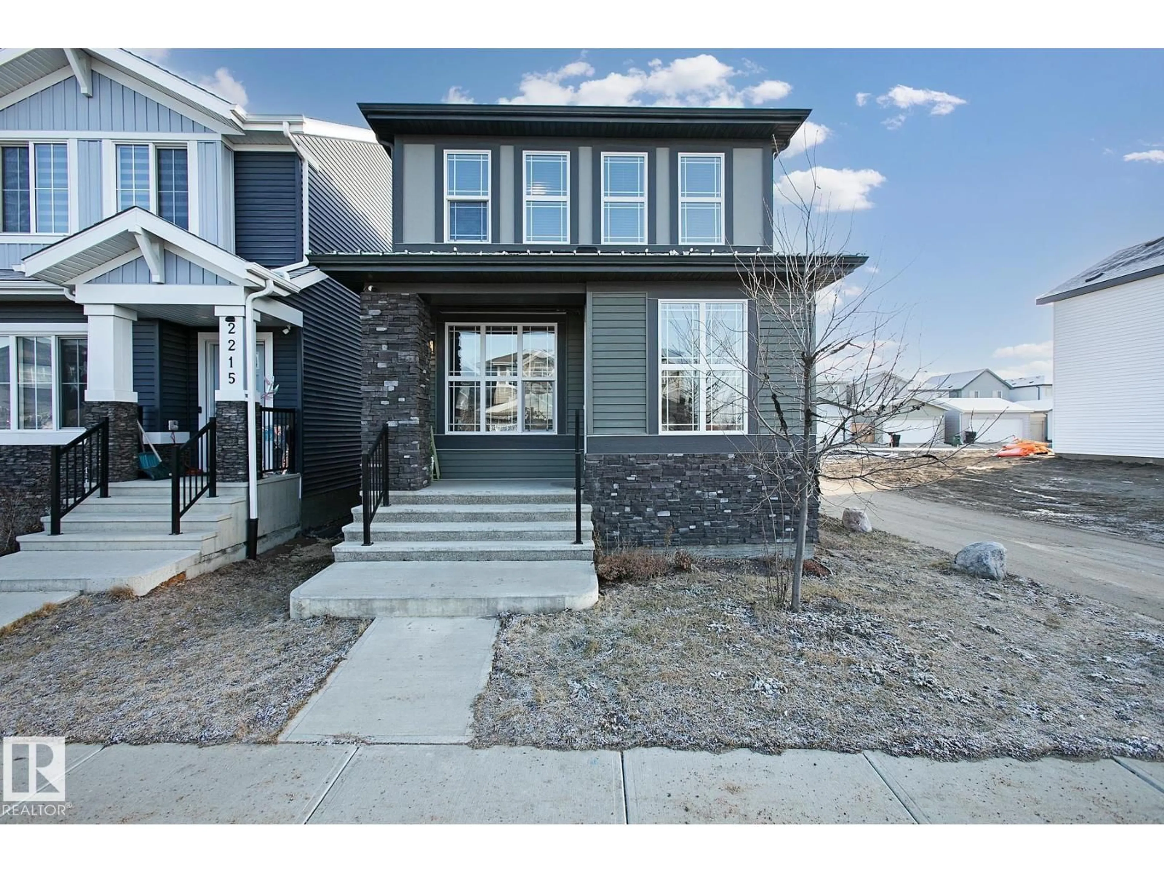 Home with vinyl exterior material, street for SW - 2219 160 ST, Edmonton Alberta T6W4E5