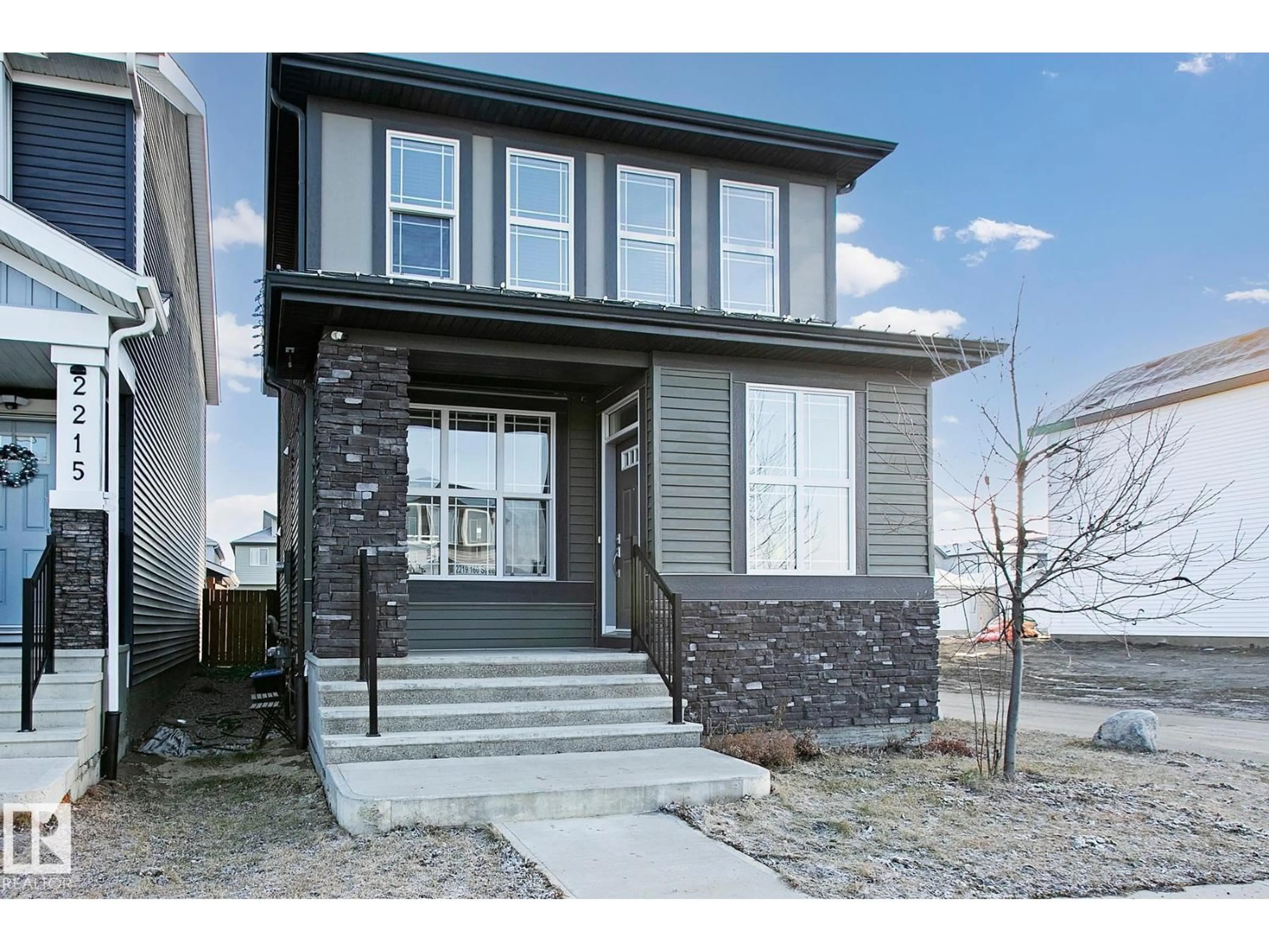 Home with vinyl exterior material, street for SW - 2219 160 ST, Edmonton Alberta T6W4E5
