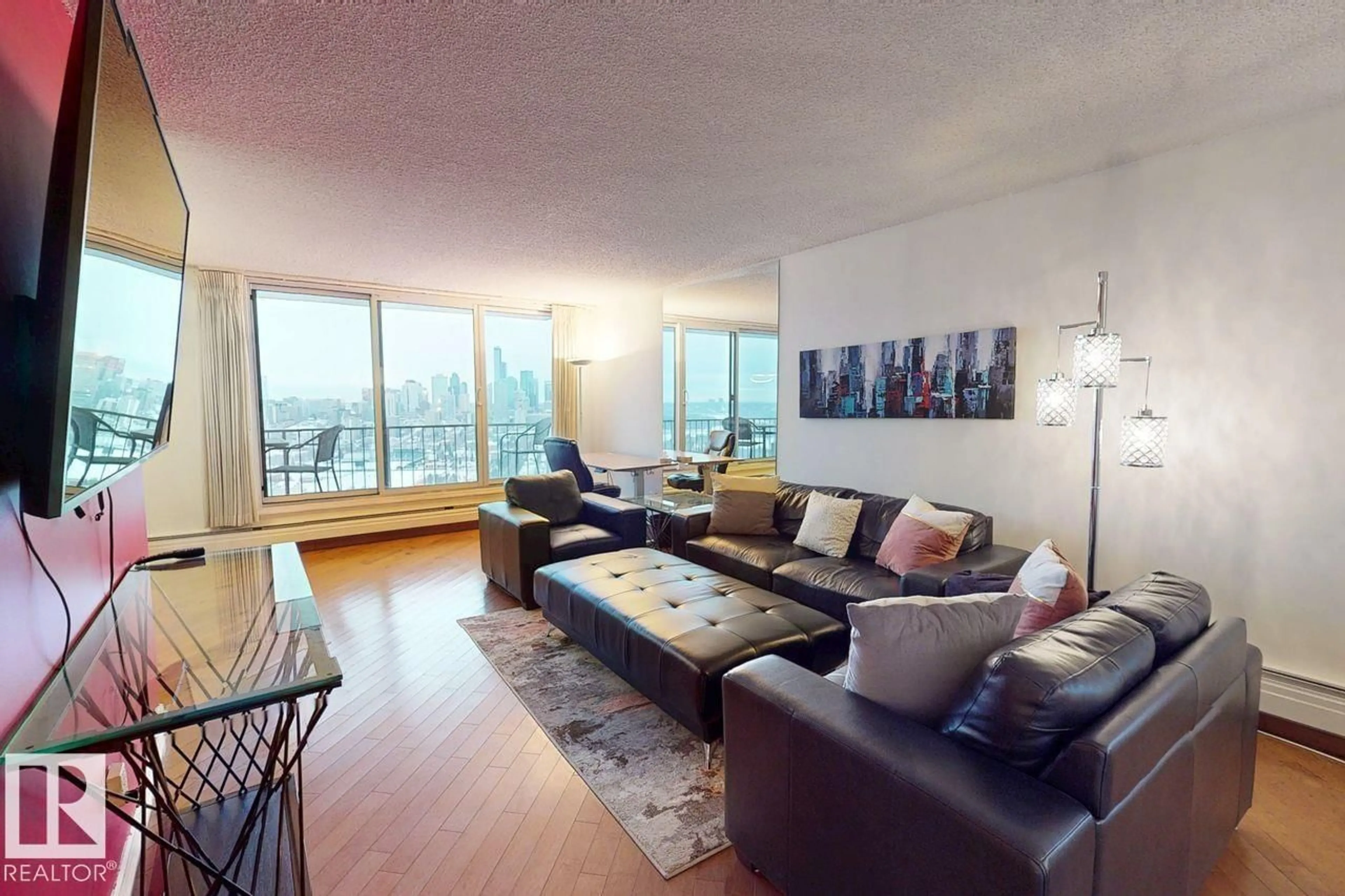 Living room with furniture, wood/laminate floor for 1605 SASKATCHEWAN DR, Edmonton Alberta T6E4Y9