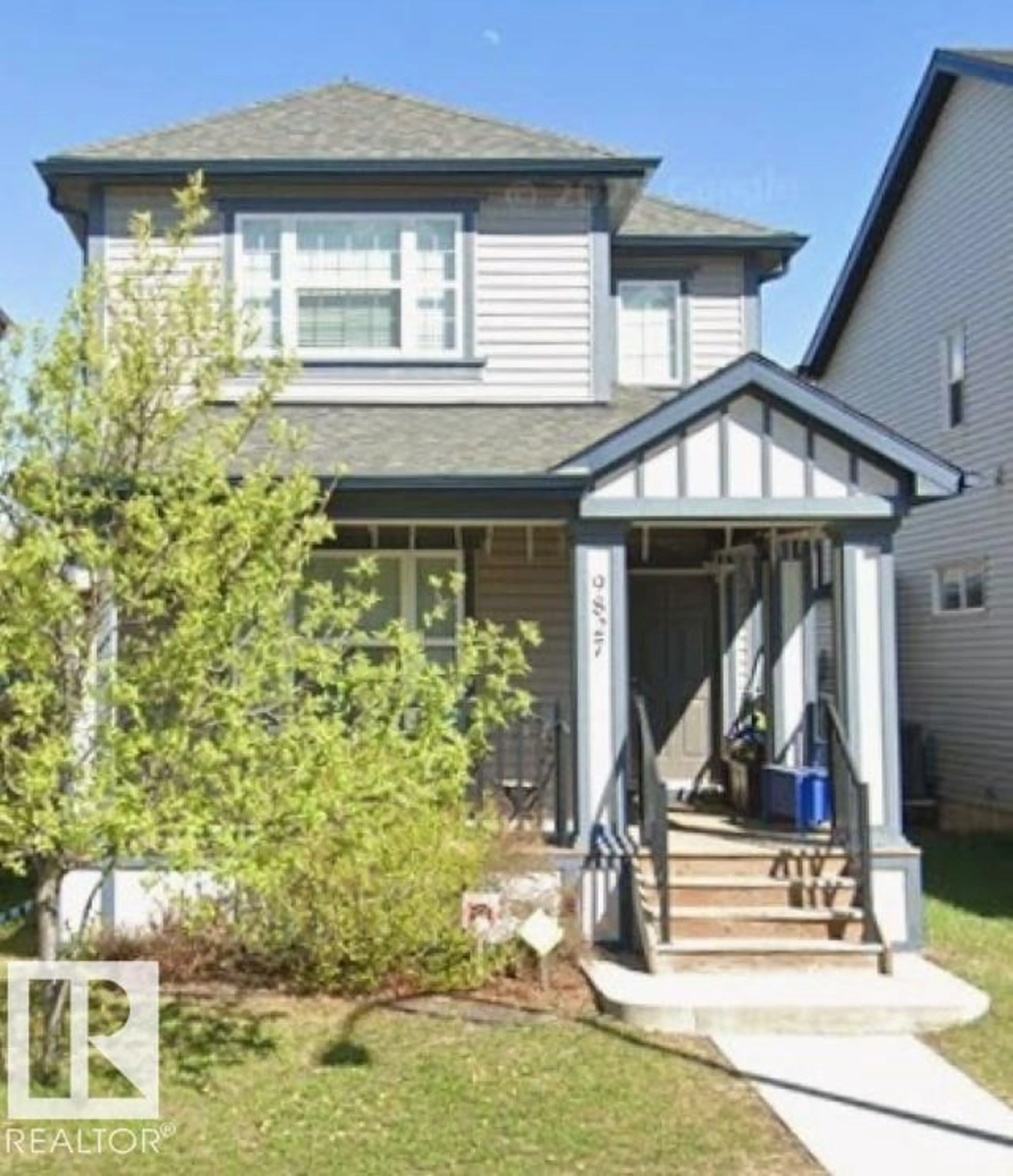 Home with vinyl exterior material, street for NW - 9827 220 ST, Edmonton Alberta T5T4M3