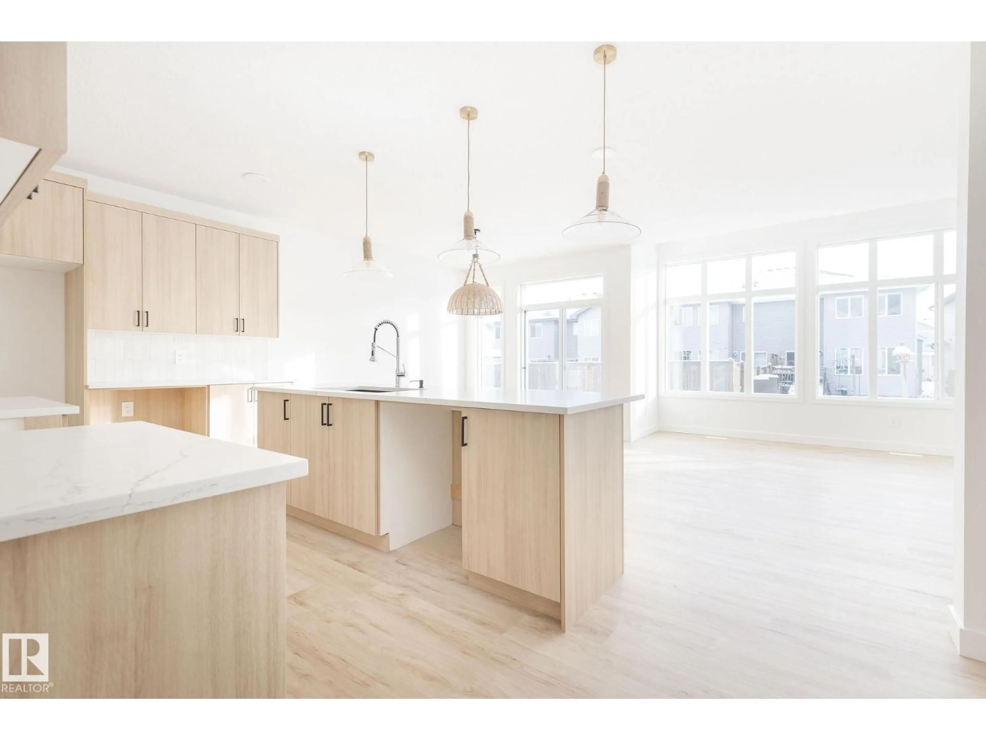 Open concept kitchen, wood/laminate floor for 20624 43 AV, Edmonton Alberta T6M3E3