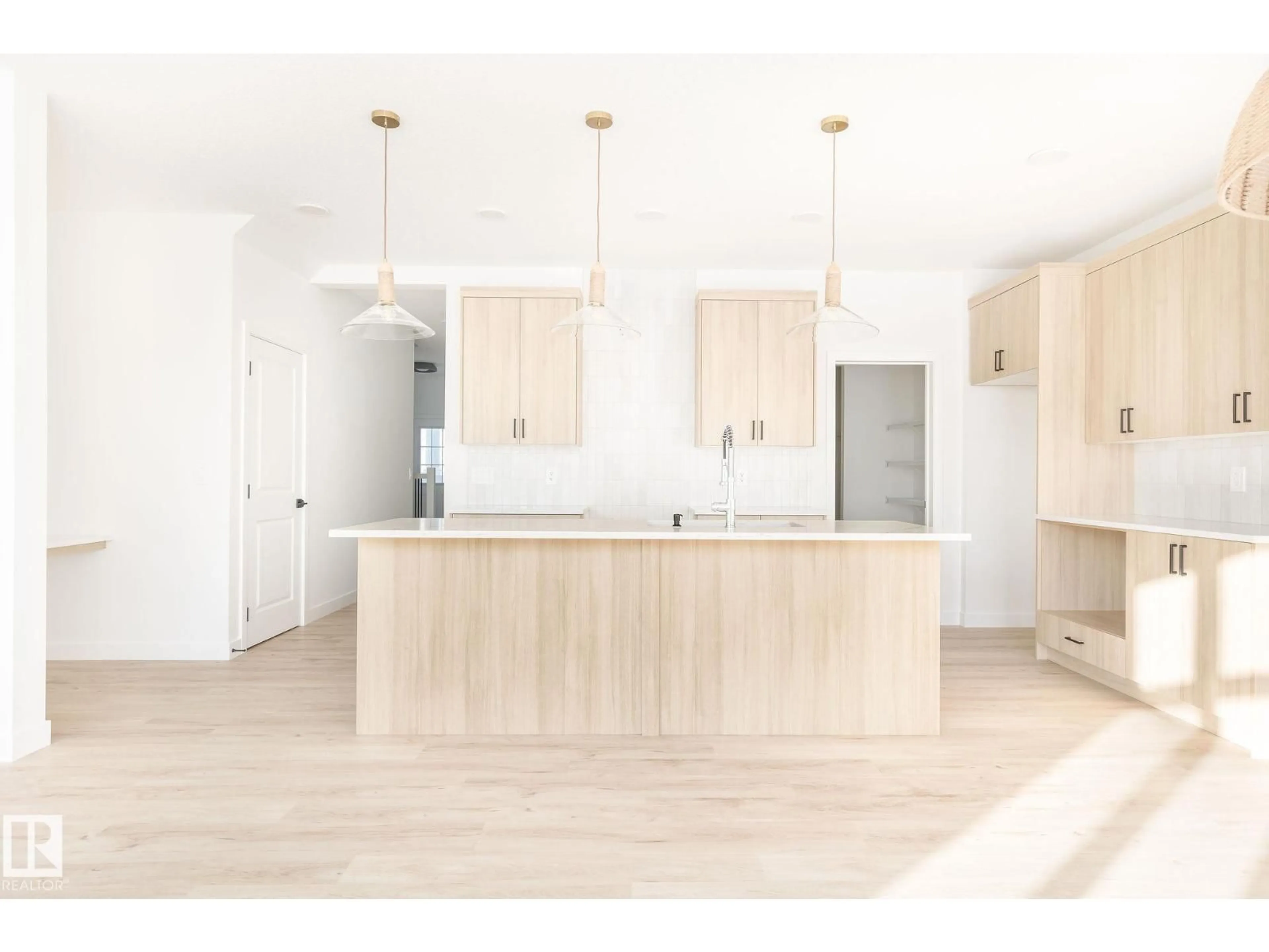 Open concept kitchen, wood/laminate floor for 20624 43 AV, Edmonton Alberta T6M3E3