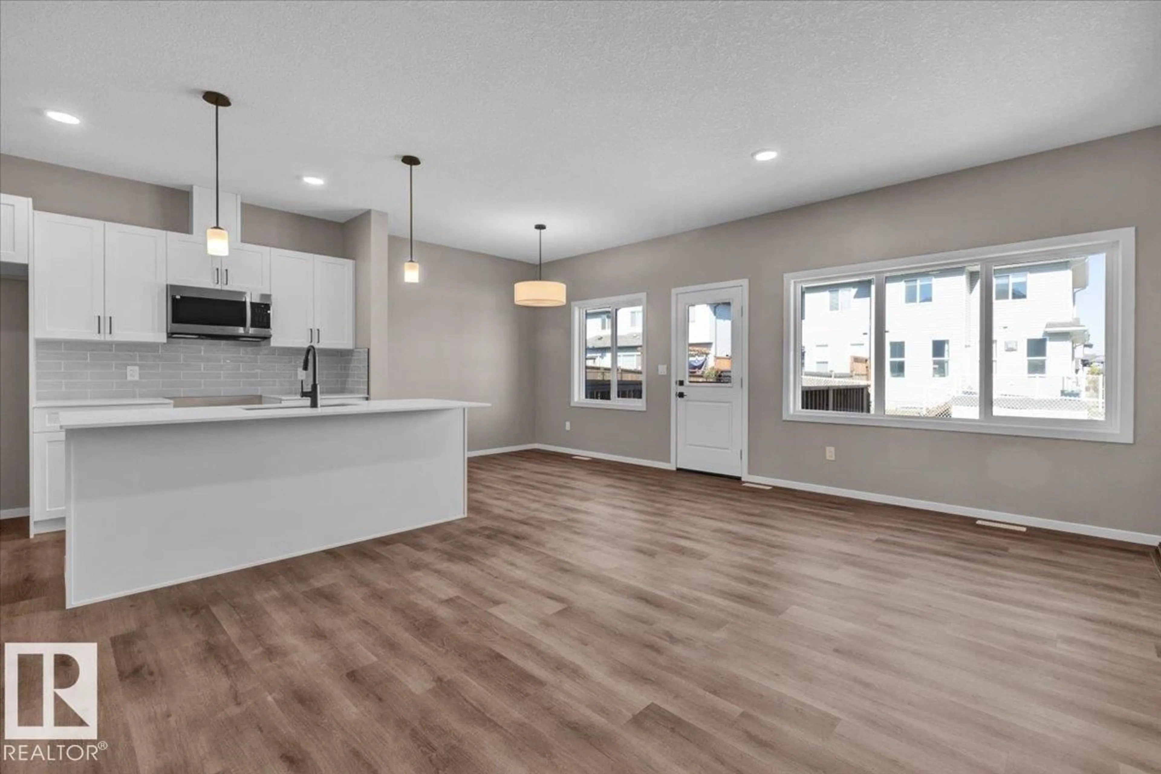 Open concept kitchen, wood/laminate floor for 1154 SOUTH CREEK WD, Stony Plain Alberta T7Z0M1