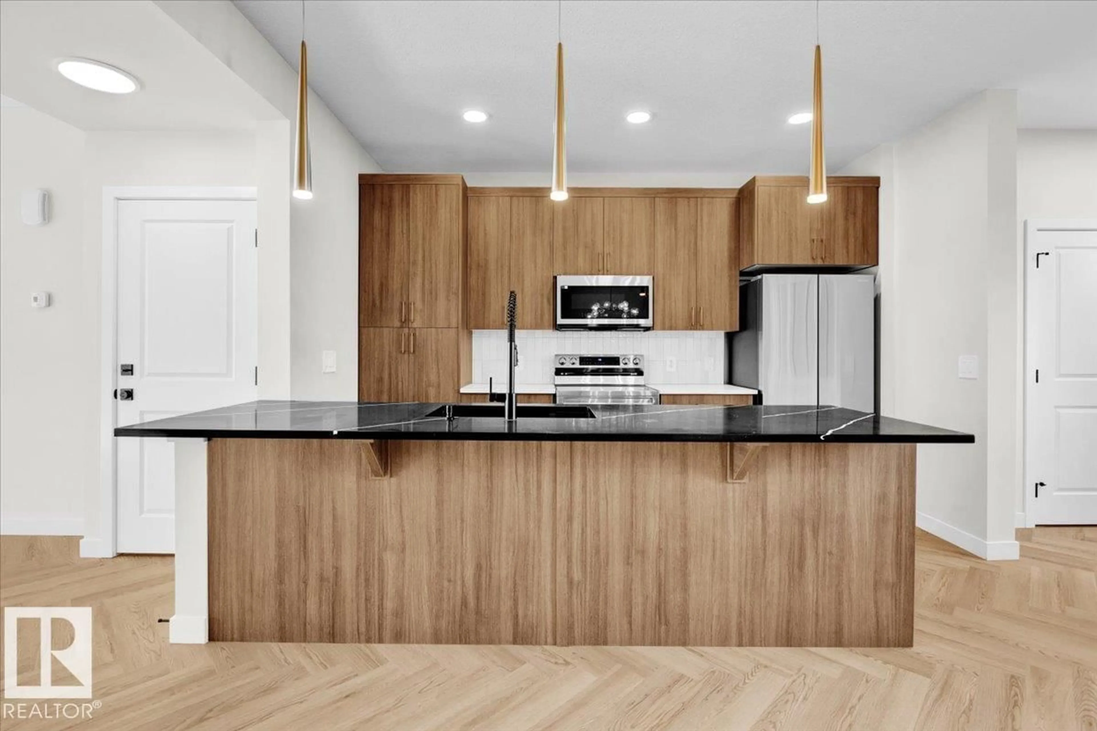 Open concept kitchen, wood/laminate floor for 1325 KESWICK DR, Edmonton Alberta T6W4V8