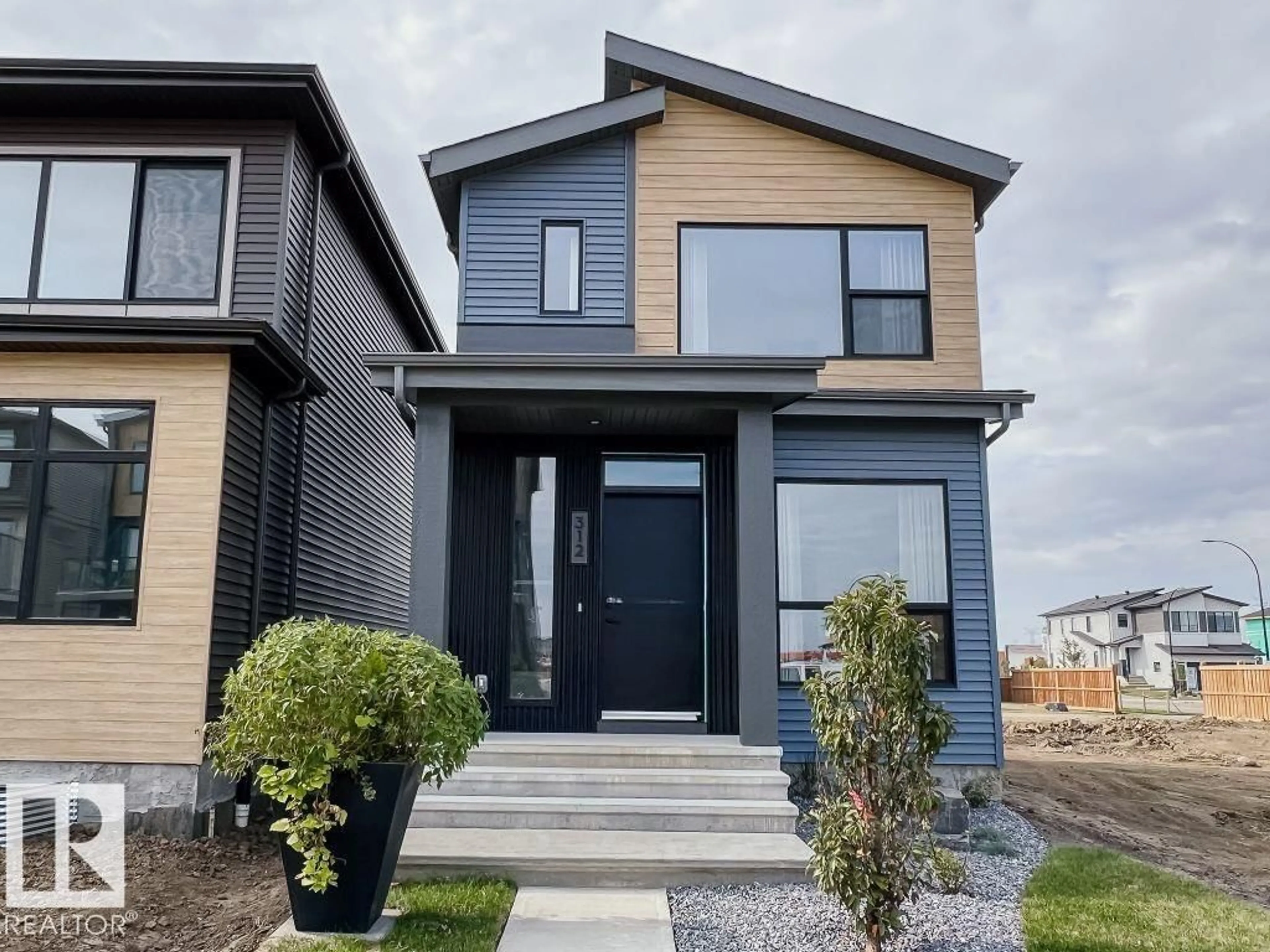 Home with vinyl exterior material, street for NW - 8128 228 ST, Edmonton Alberta T5T4N5