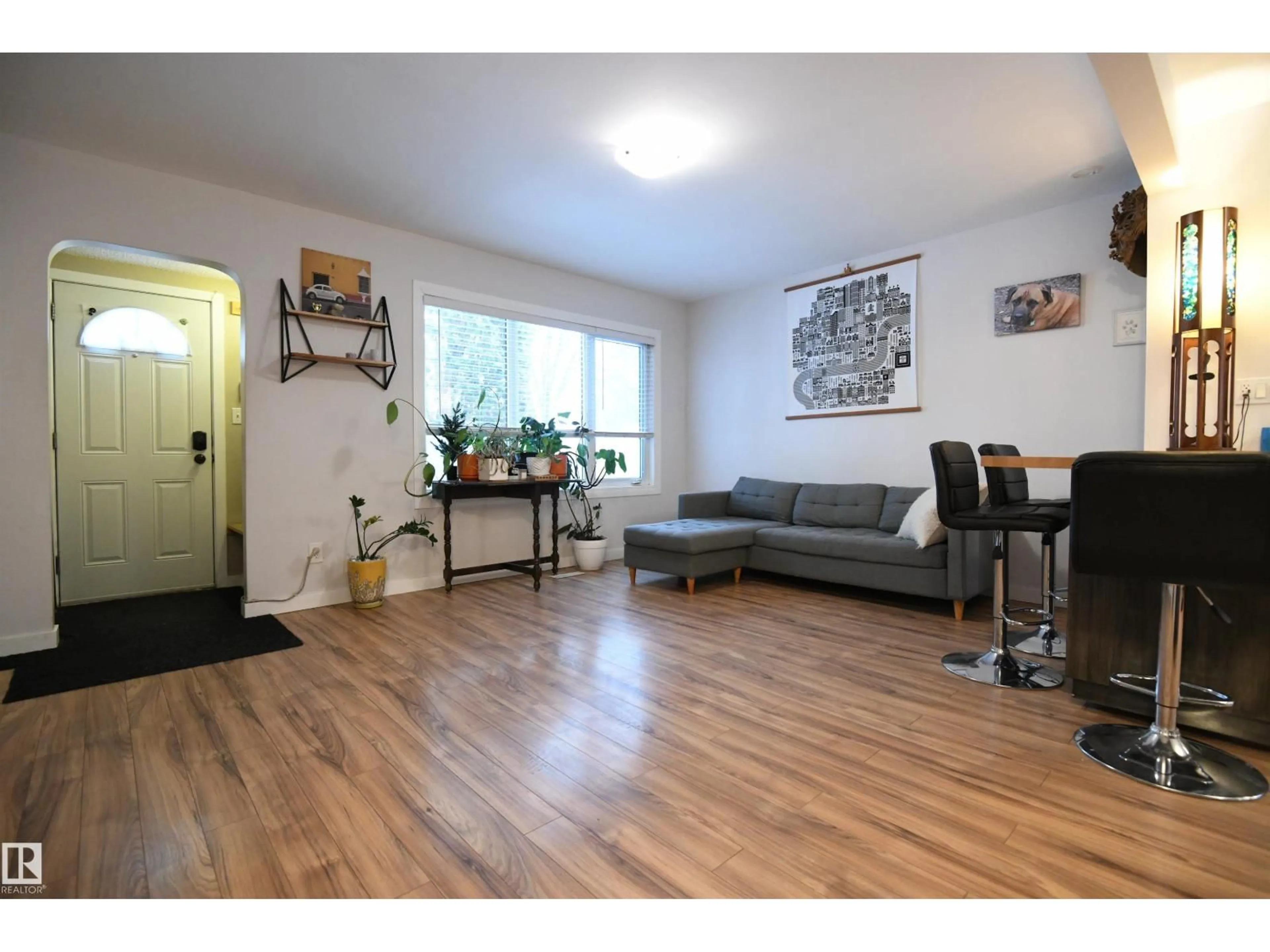 Living room with furniture, wood/laminate floor for 11622 123 ST, Edmonton Alberta T5M0G6
