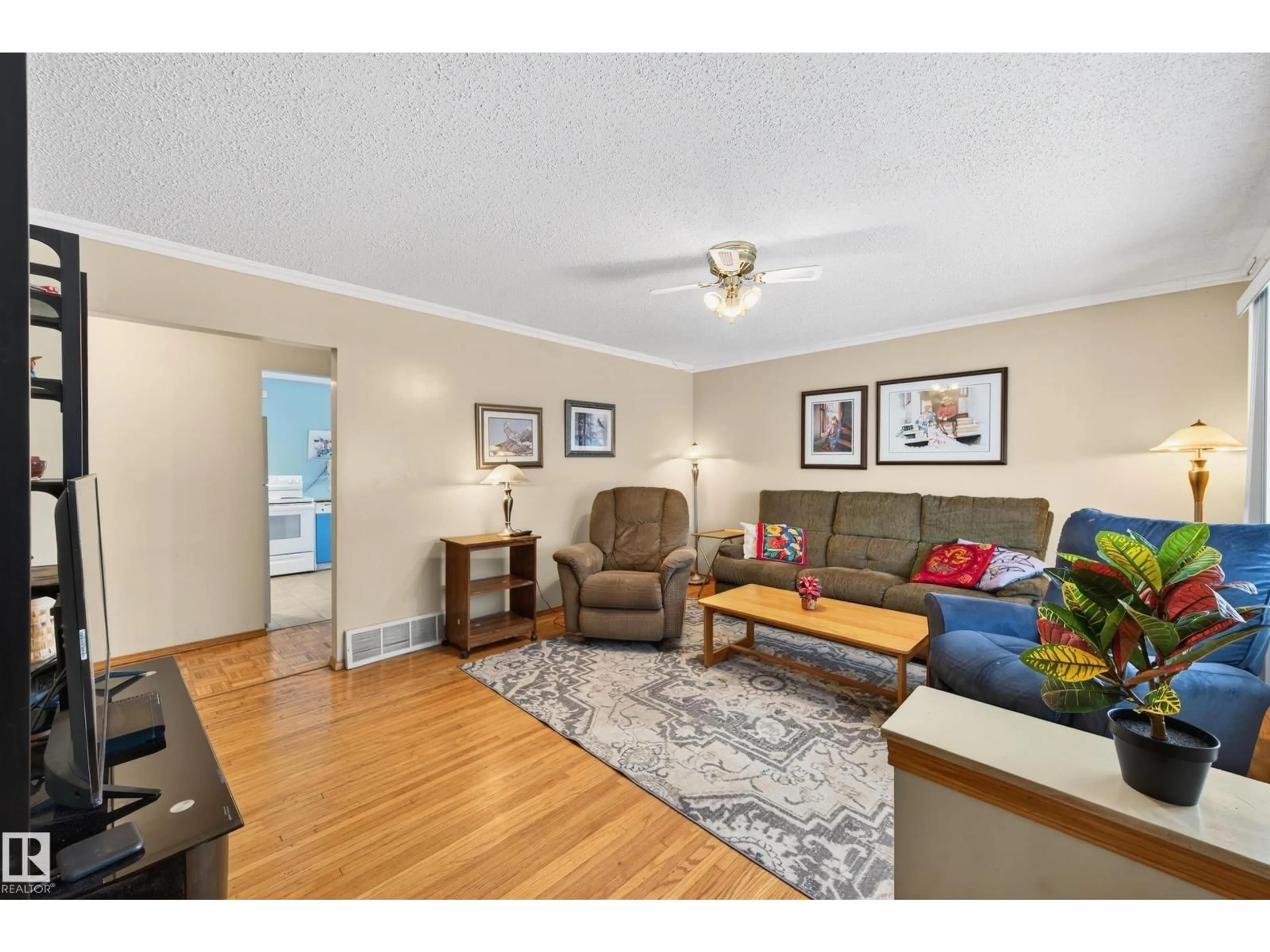 Living room with furniture, wood/laminate floor for NW - 10801 156 ST, Edmonton Alberta T5P2S5