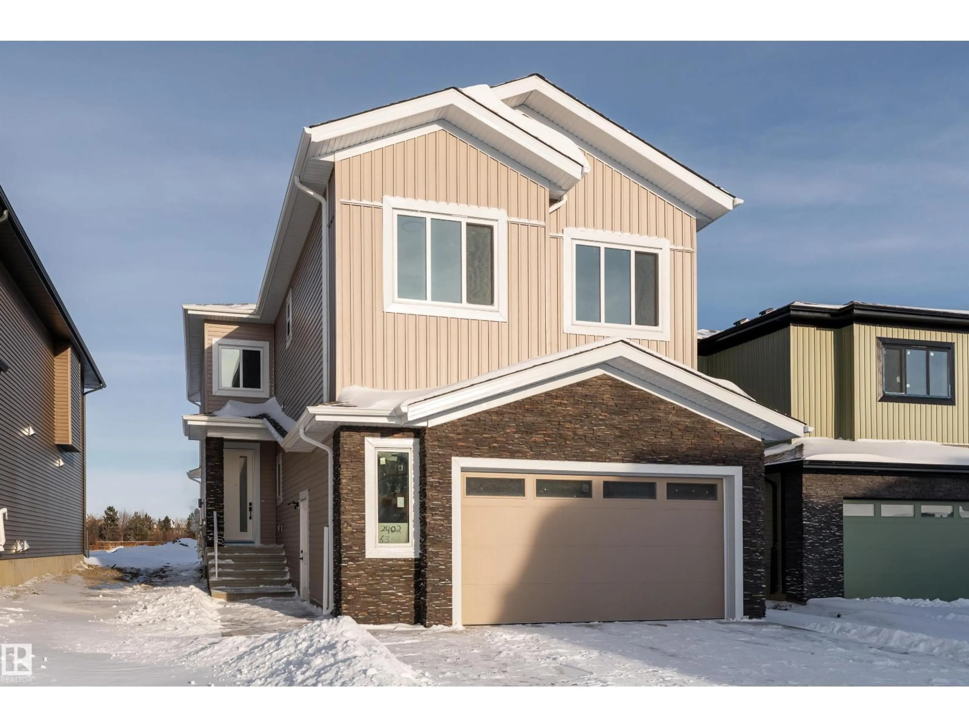Home with vinyl exterior material, street for NE - 2402 63 AV, Rural Leduc County Alberta T4X0K5