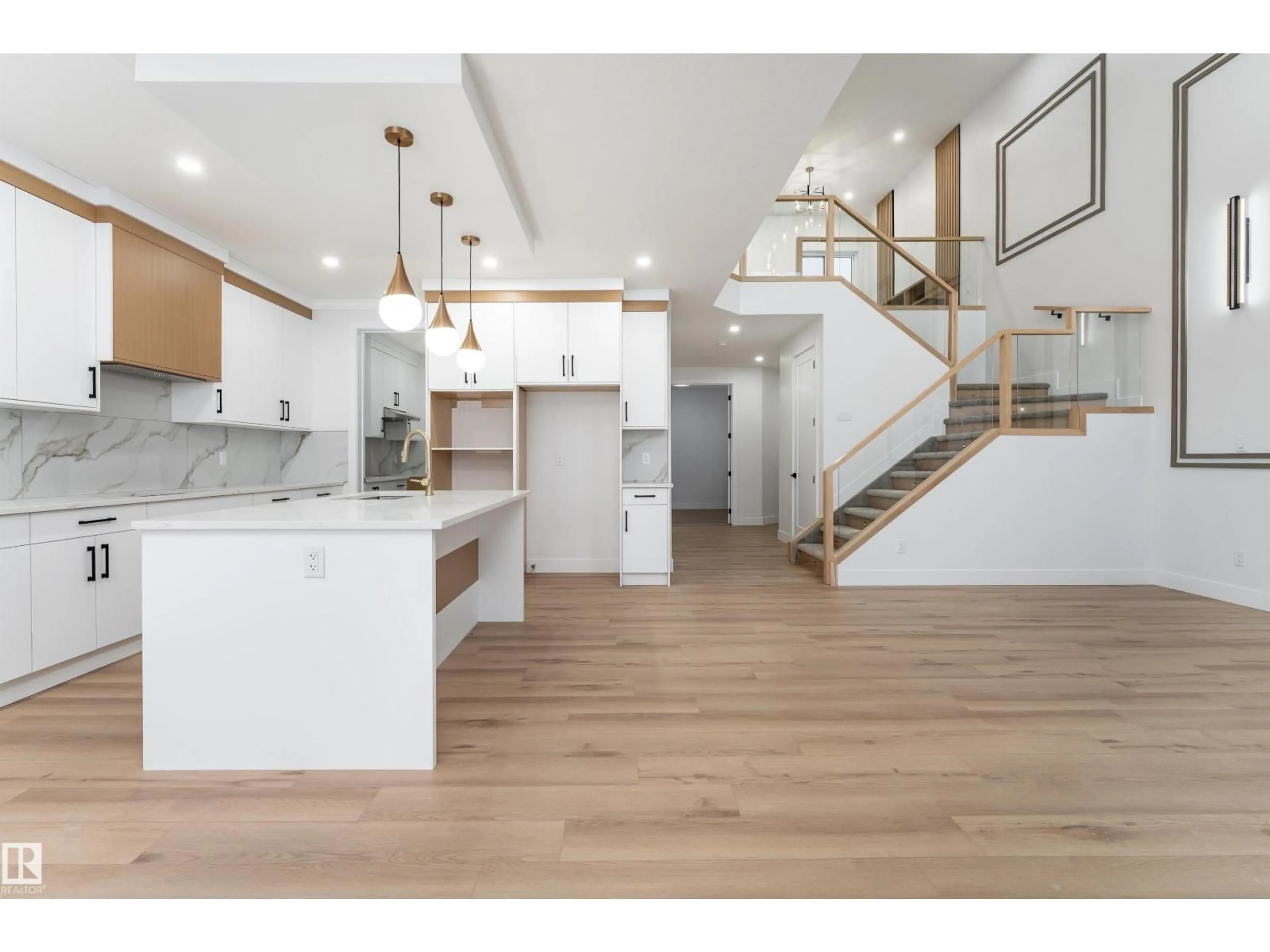 Open concept kitchen, wood/laminate floor for NE - 2402 63 AV, Rural Leduc County Alberta T4X0K5