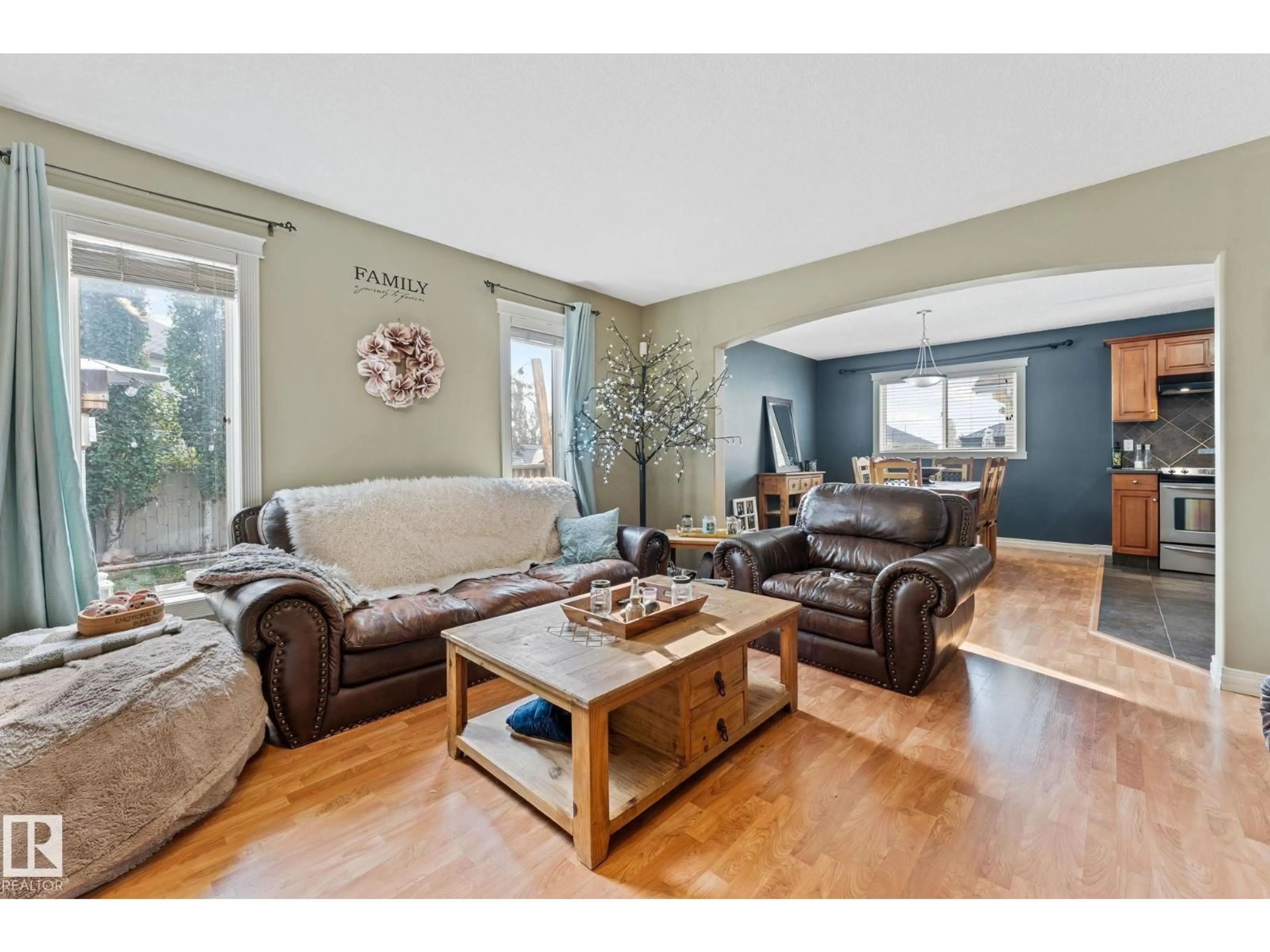 Living room with furniture, wood/laminate floor for 7907 96 ST, Morinville Alberta T8R1W1