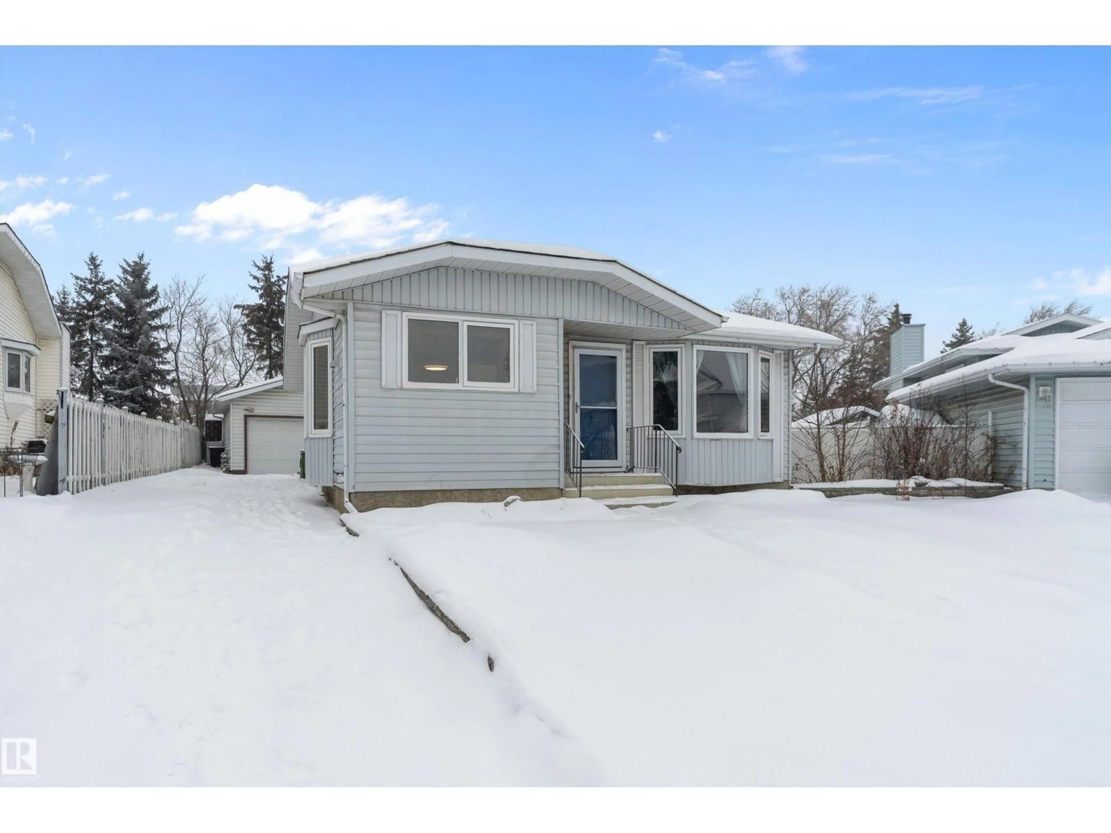 Home with vinyl exterior material, street for 128 WARWICK CR, Edmonton Alberta T5X5P3