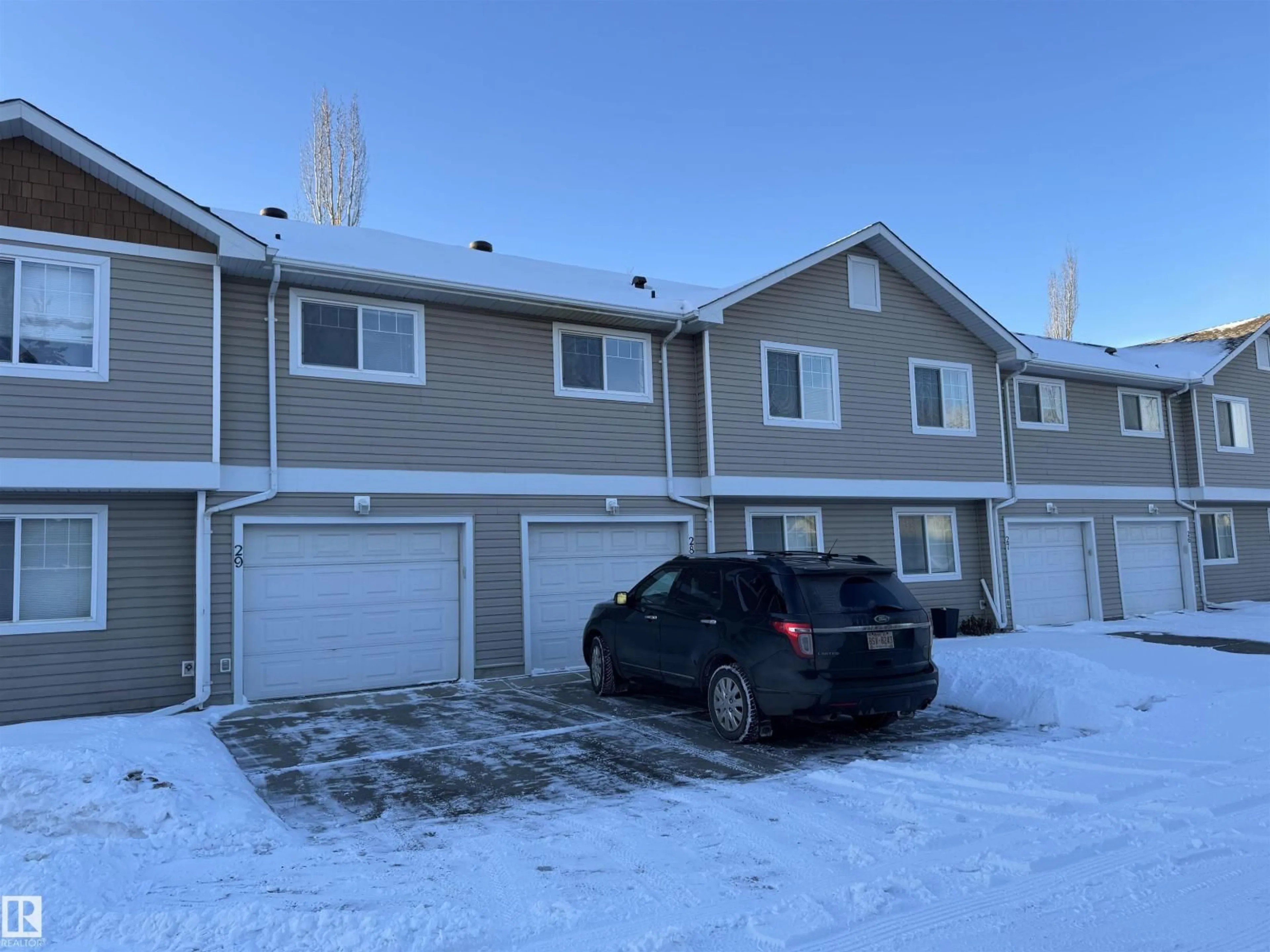 A pic from outside/outdoor area/front of a property/back of a property/a pic from drone, street for 70 - 28 CAVAN RD, Sherwood Park Alberta T8H2W9