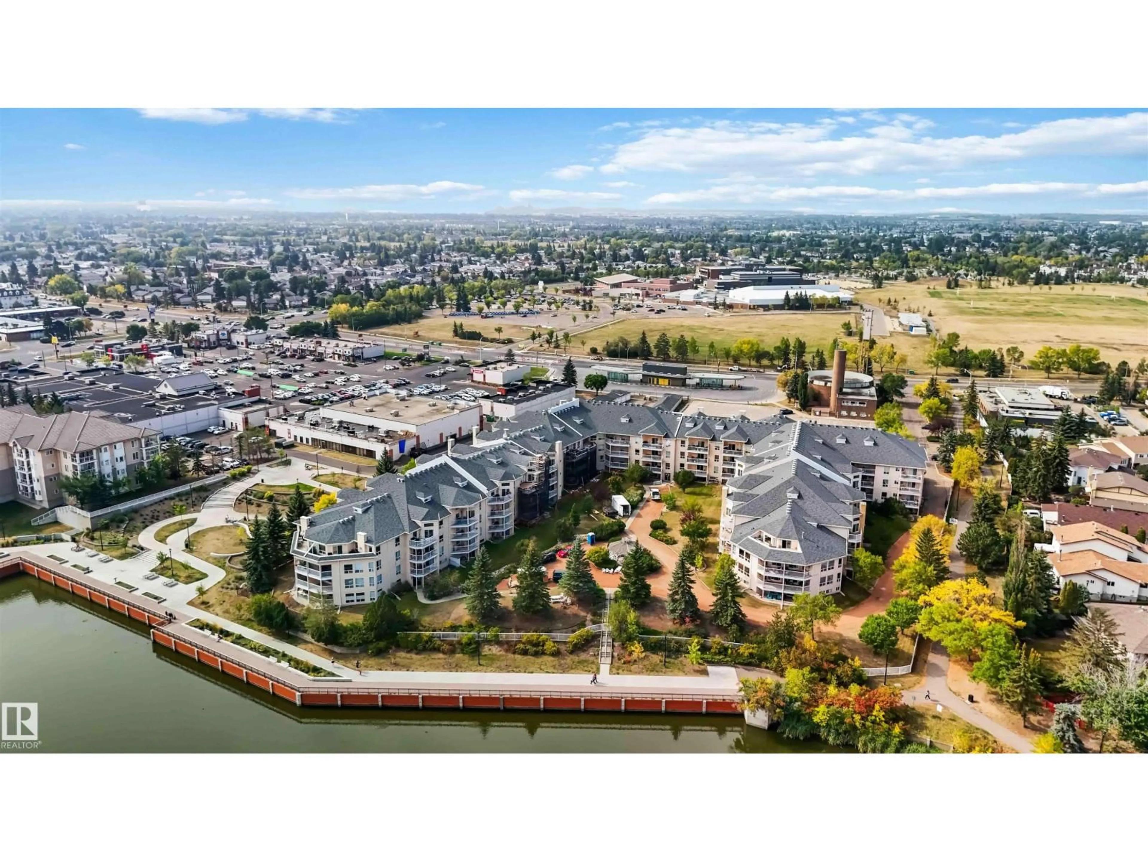 A pic from outside/outdoor area/front of a property/back of a property/a pic from drone, water/lake/river/ocean view for #312 - 15499 CASTLE DOWNS RD, Edmonton Alberta T5X5Y3