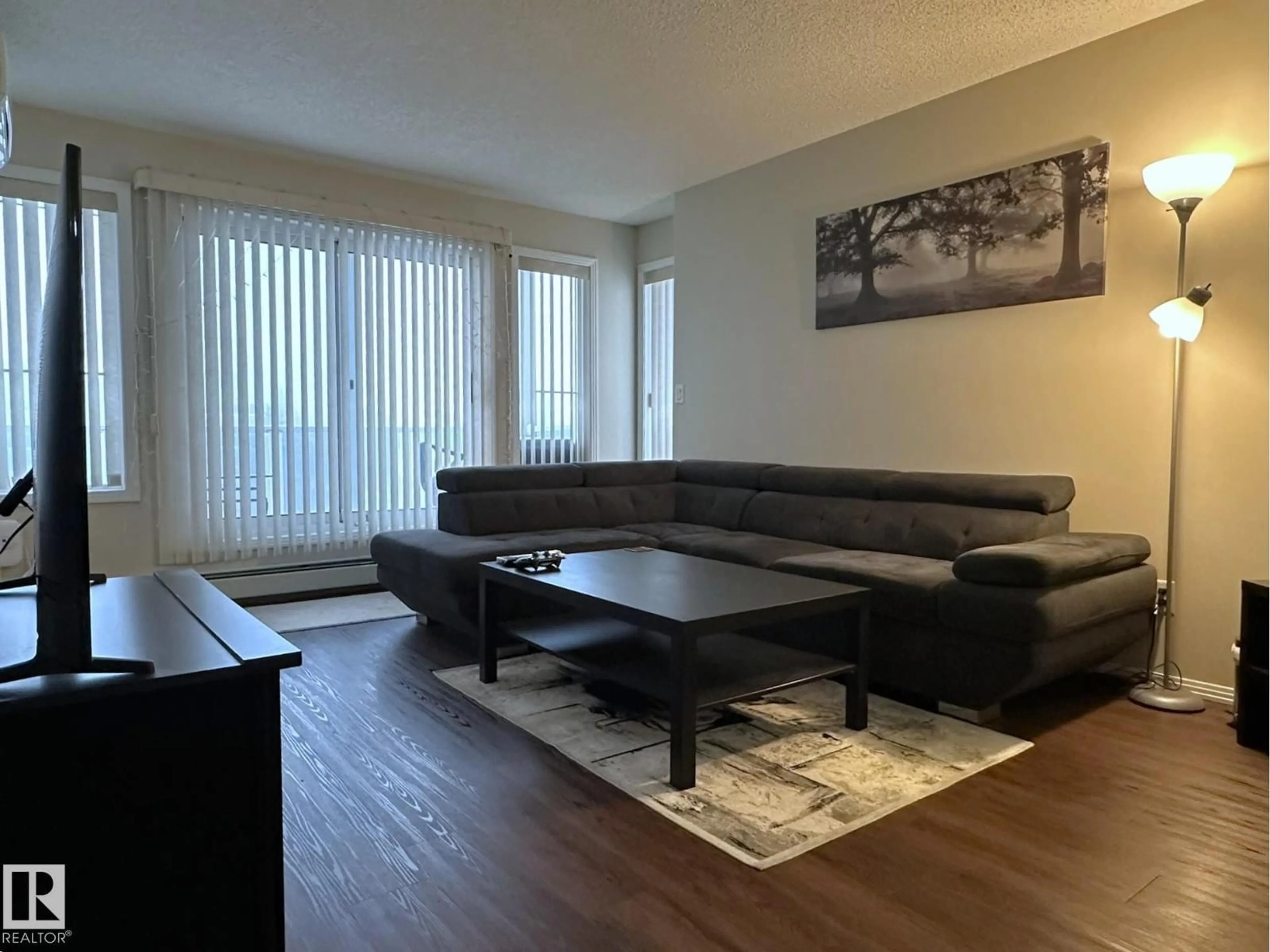 Living room with furniture, wood/laminate floor for 9730 - 315 174 ST, Edmonton Alberta T5T6J4