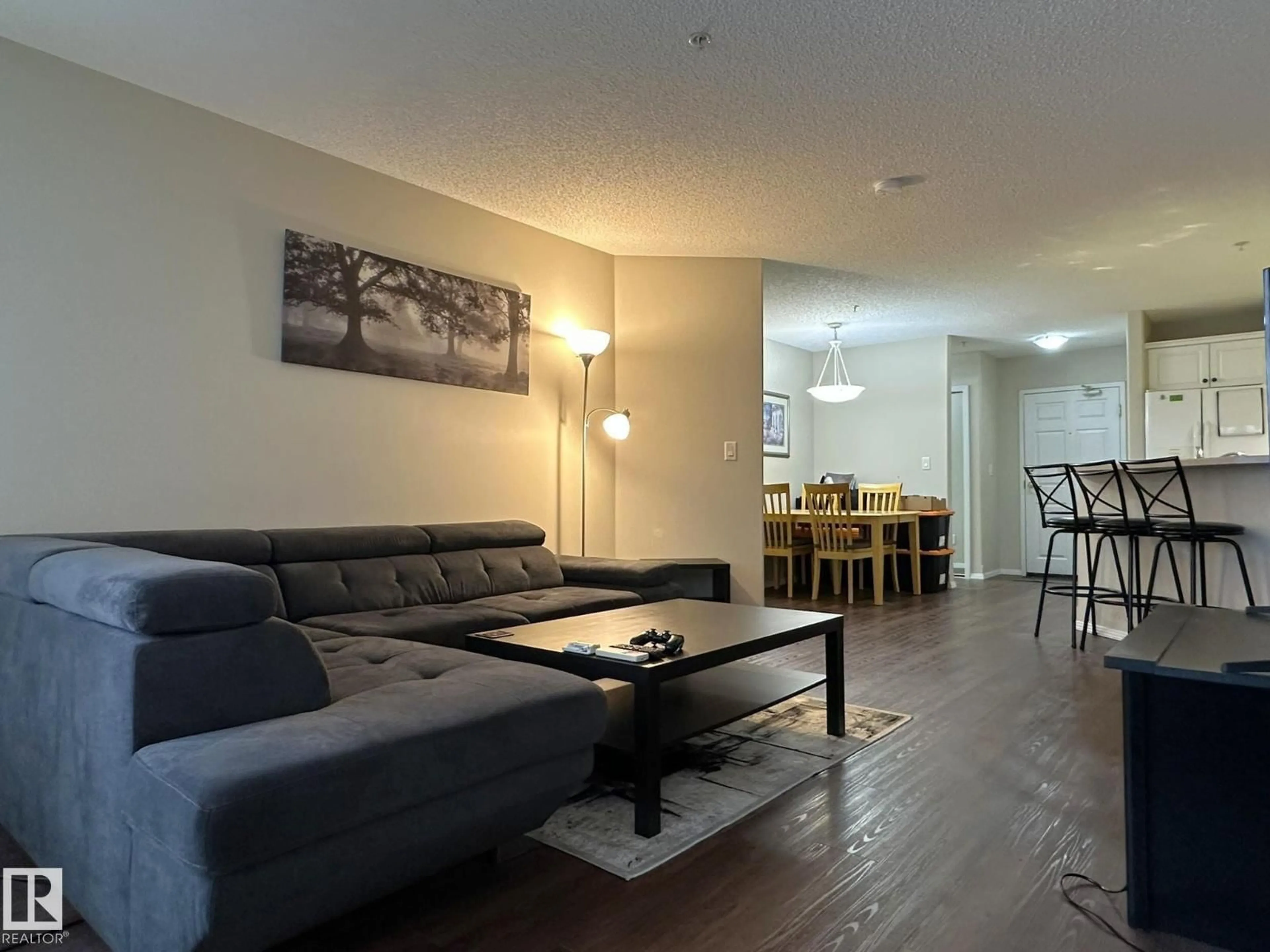 Living room with furniture, wood/laminate floor for 9730 - 315 174 ST, Edmonton Alberta T5T6J4