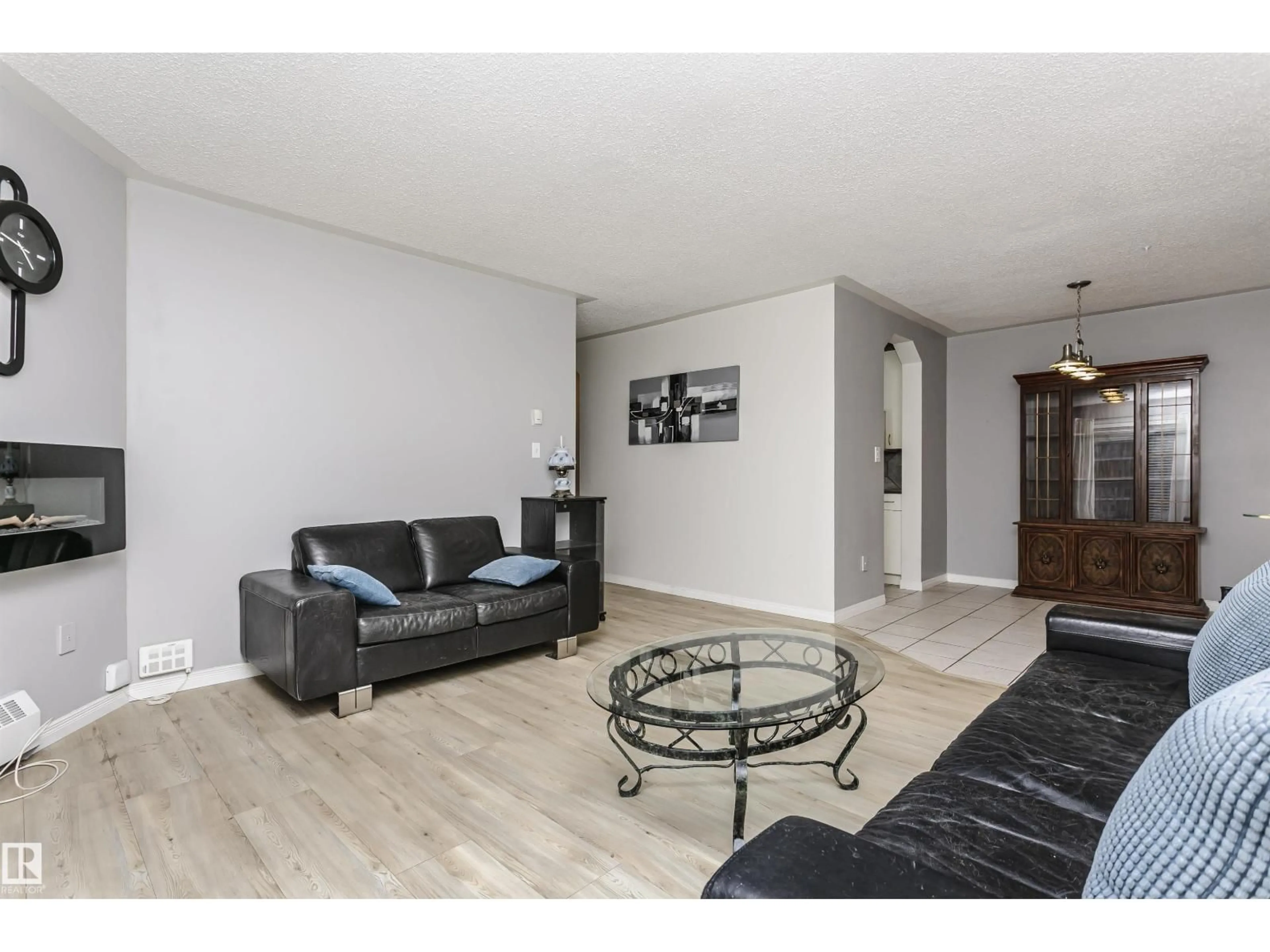 Living room with furniture, wood/laminate floor for #302 - 5005 31 AV, Edmonton Alberta T6L6S6
