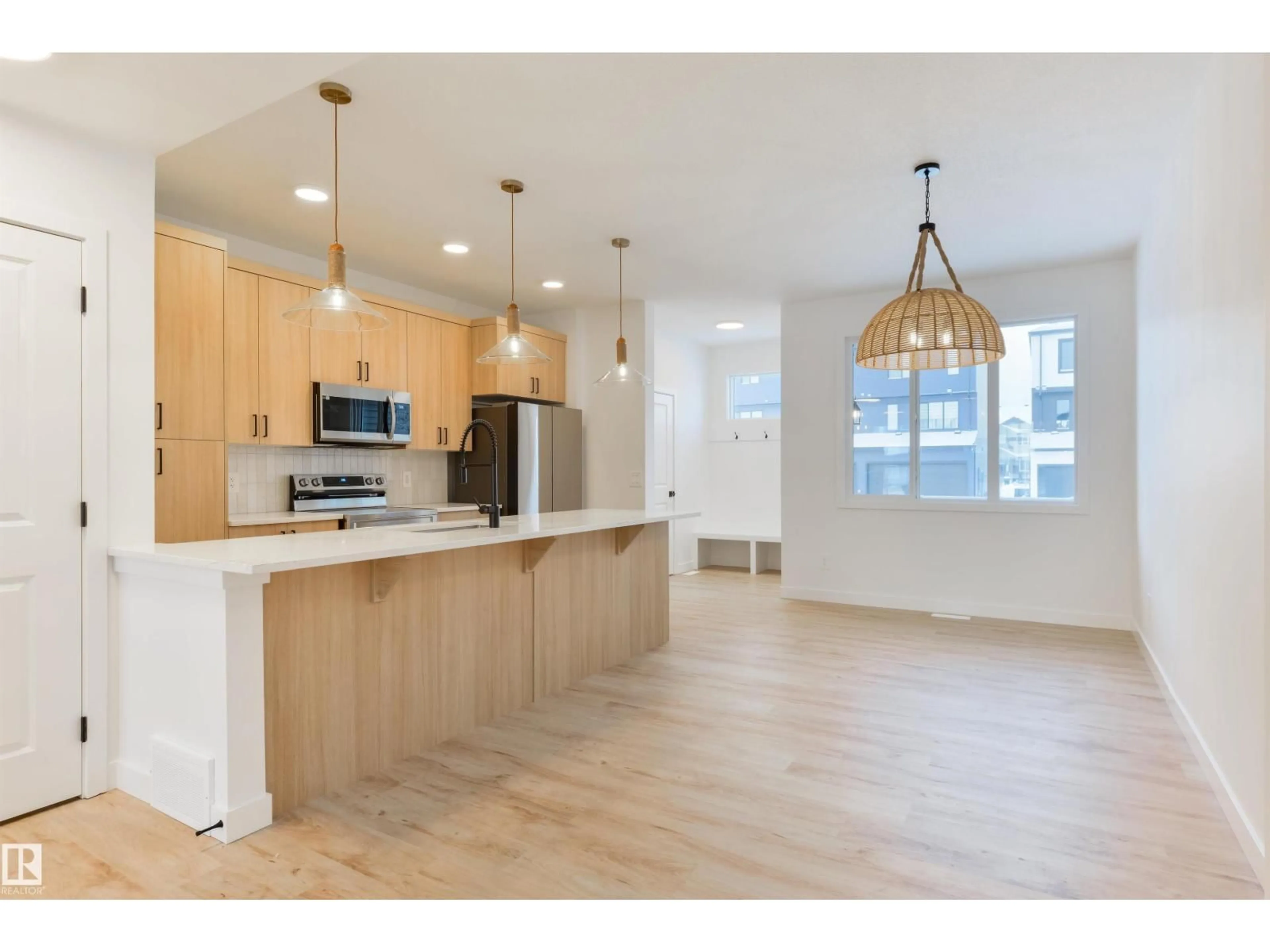 Open concept kitchen, wood/laminate floor for 7 COBBLESTONE GA, Spruce Grove Alberta T7X4E4