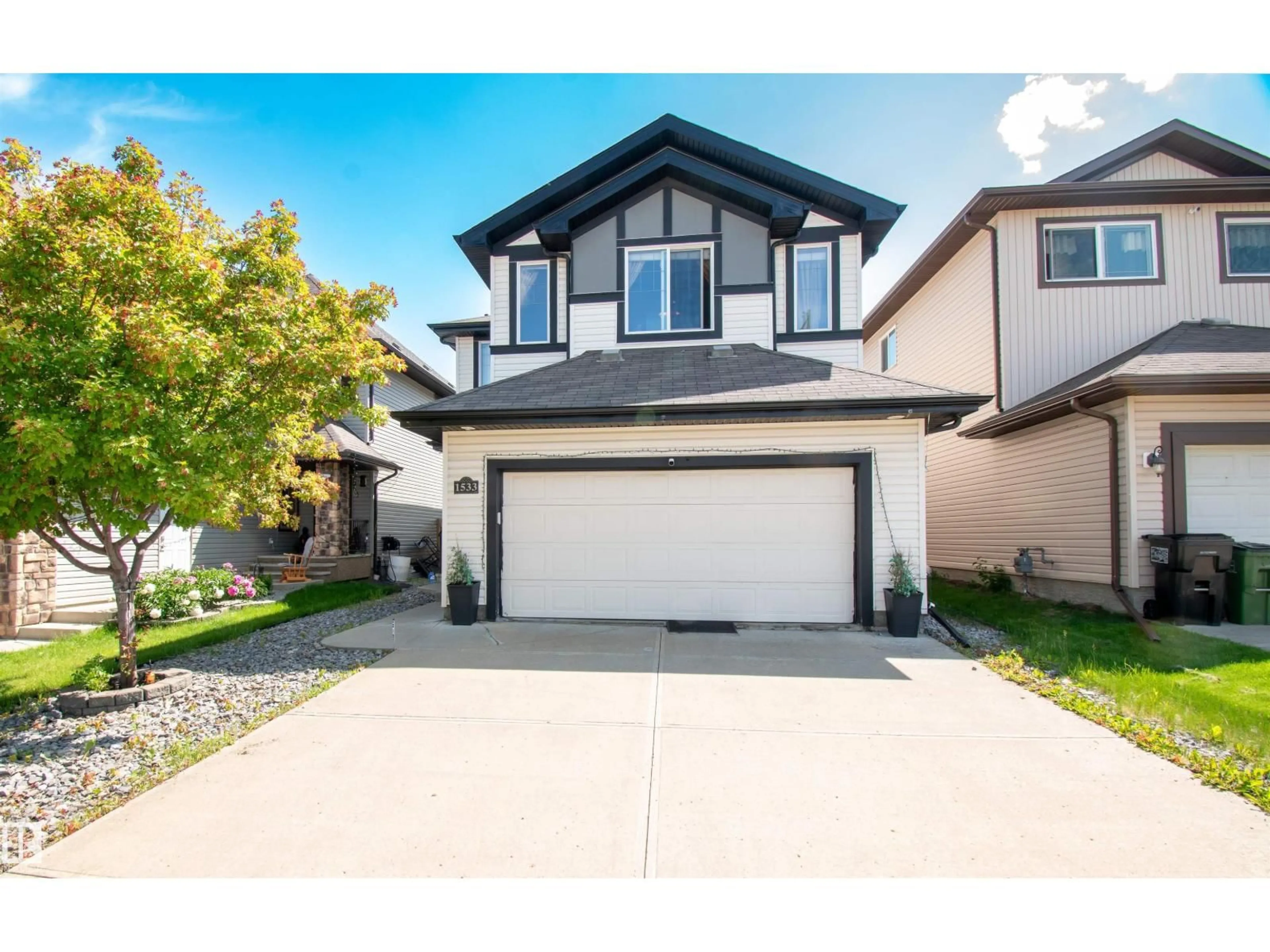 Home with vinyl exterior material, street for NW - 1533 36B AV, Edmonton Alberta T6T0M4