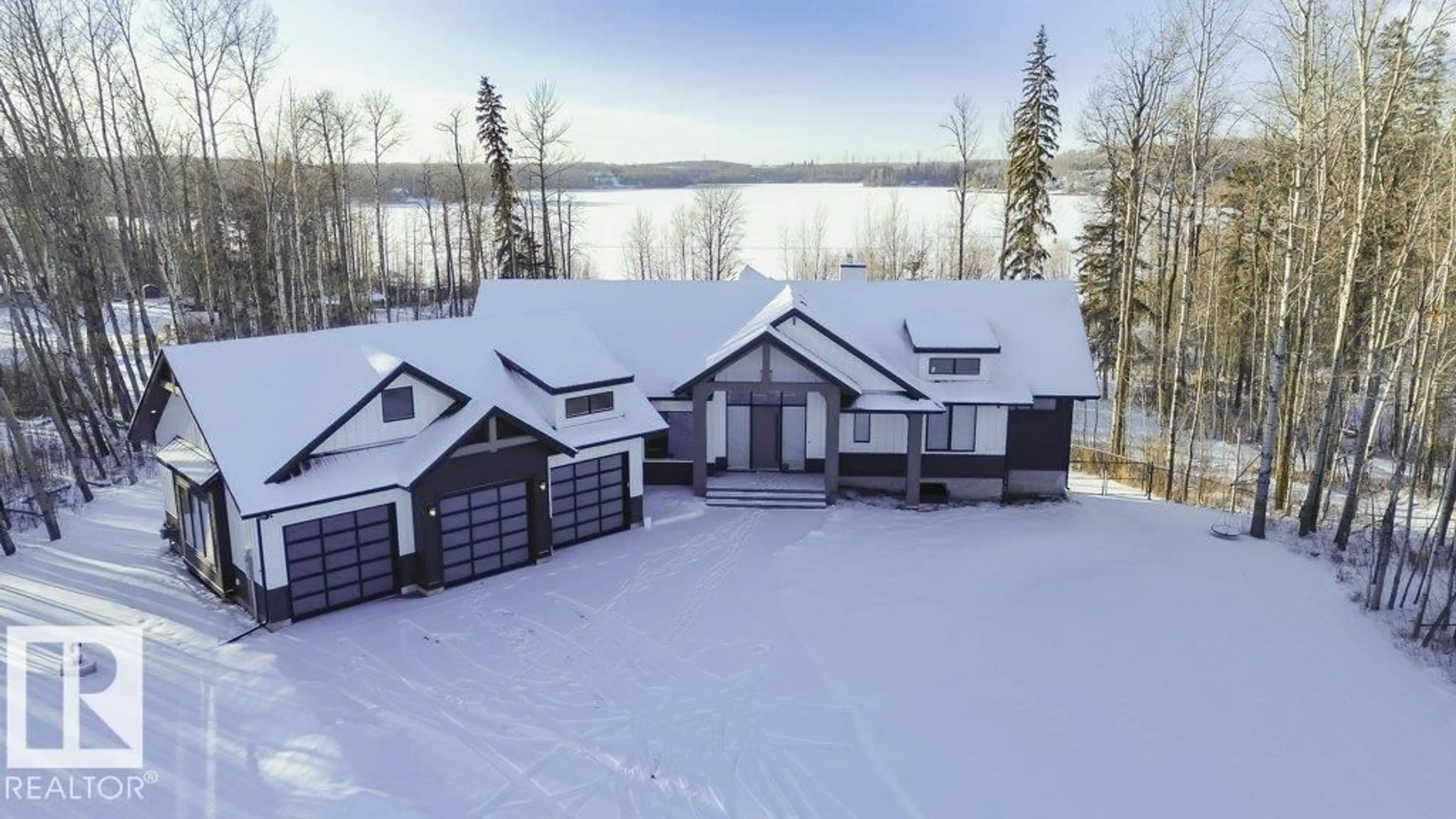 A pic from outside/outdoor area/front of a property/back of a property/a pic from drone, water/lake/river/ocean view for 42 - 2307 TWP ROAD 522, Rural Parkland County Alberta T7Y3L7