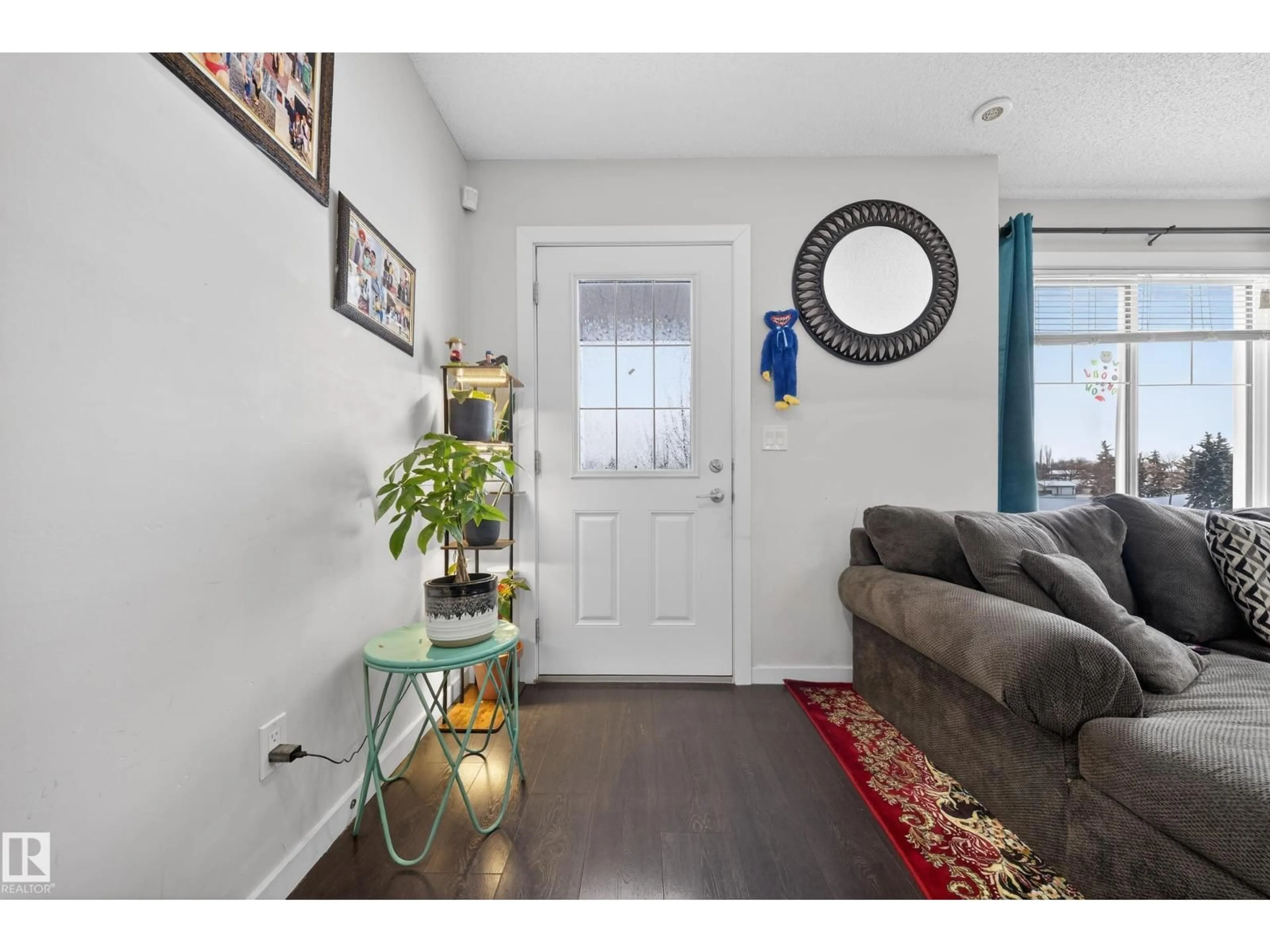 Indoor entryway for #11 - 3025 151 AV, Edmonton Alberta T5Y3W4