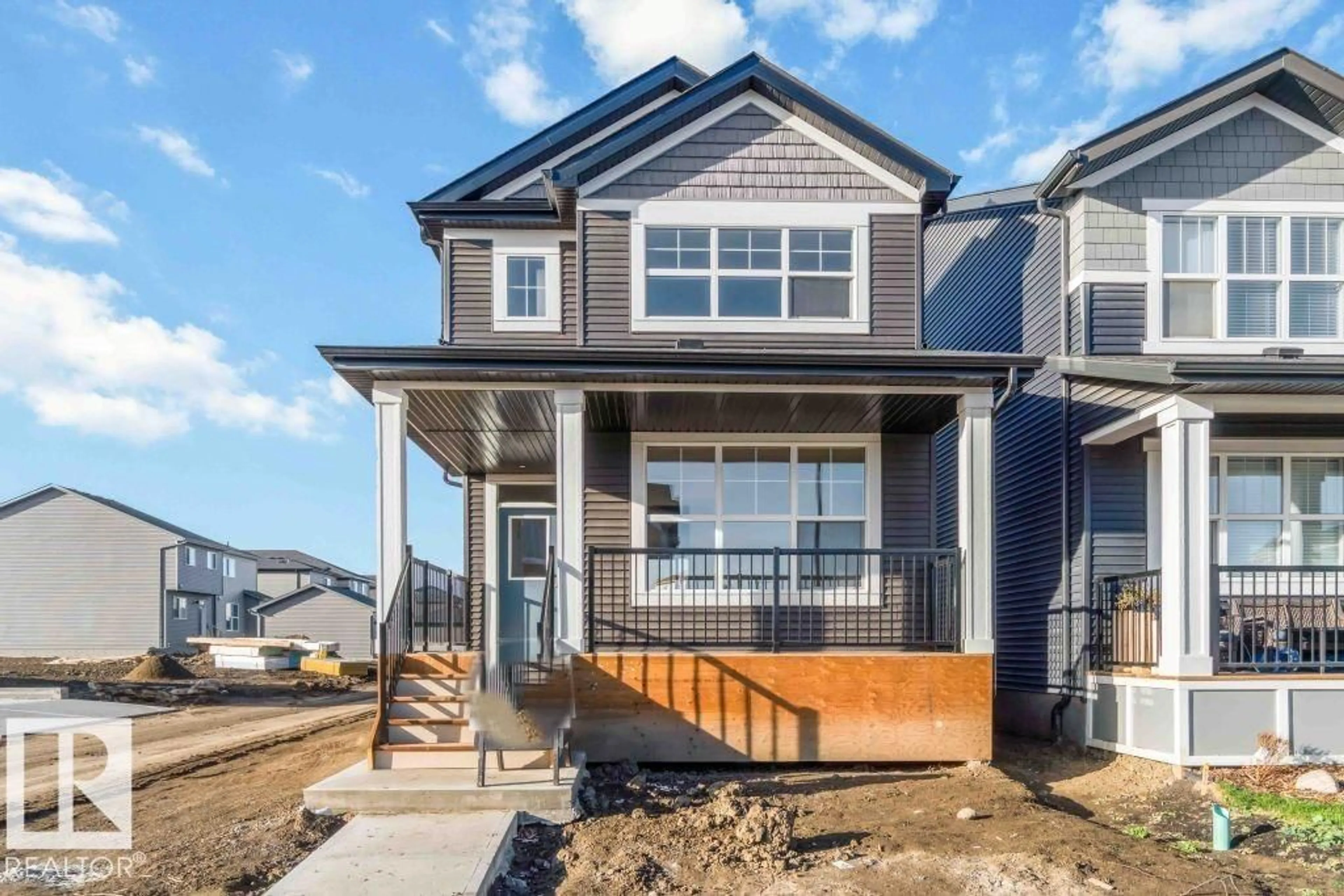 Home with vinyl exterior material, street for 7106 50A AV, Beaumont Alberta T4X1B8