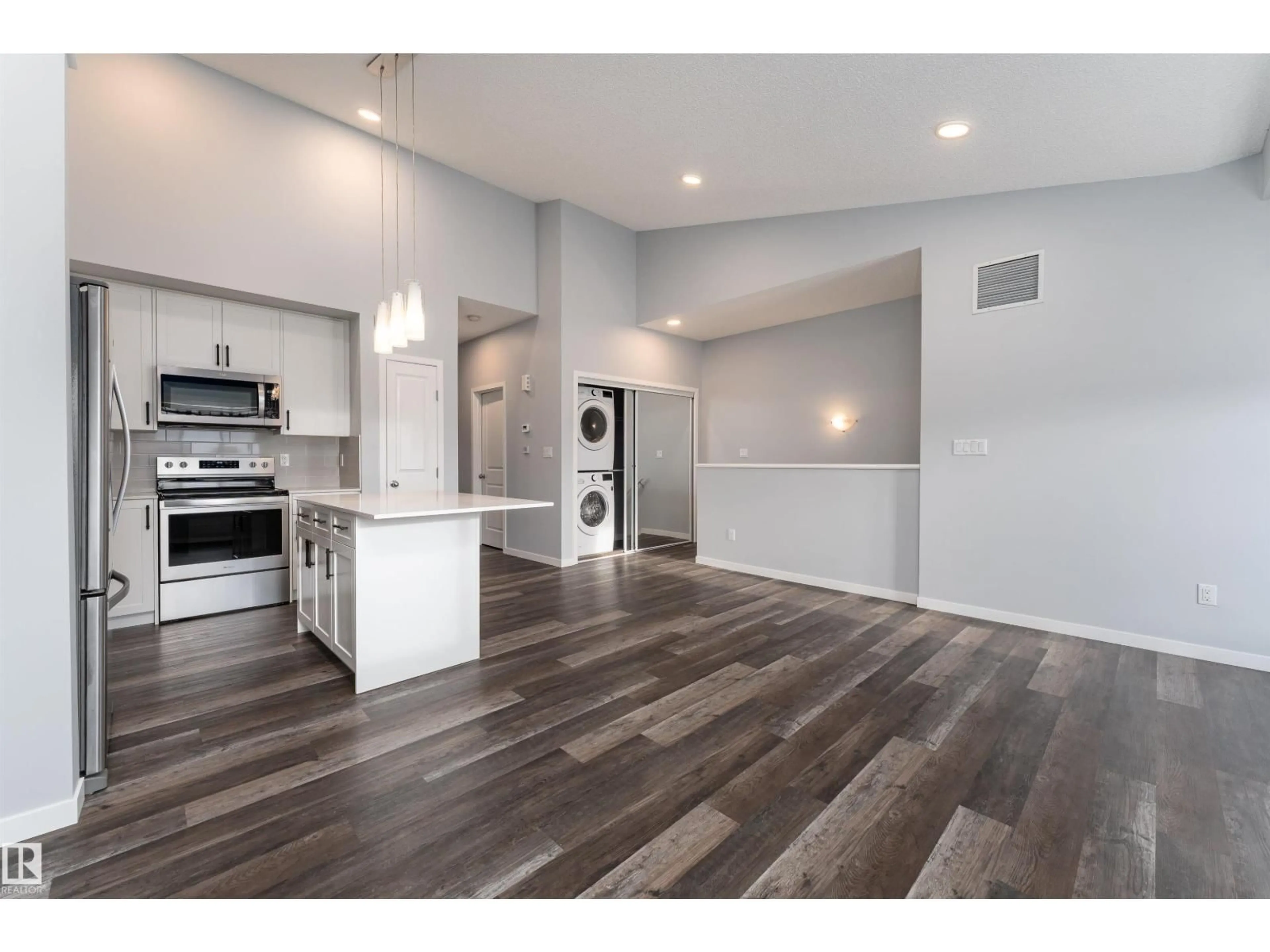 Open concept kitchen, wood/laminate floor for 56 - 3305 ORCHARDS LI, Edmonton Alberta T6X2H1