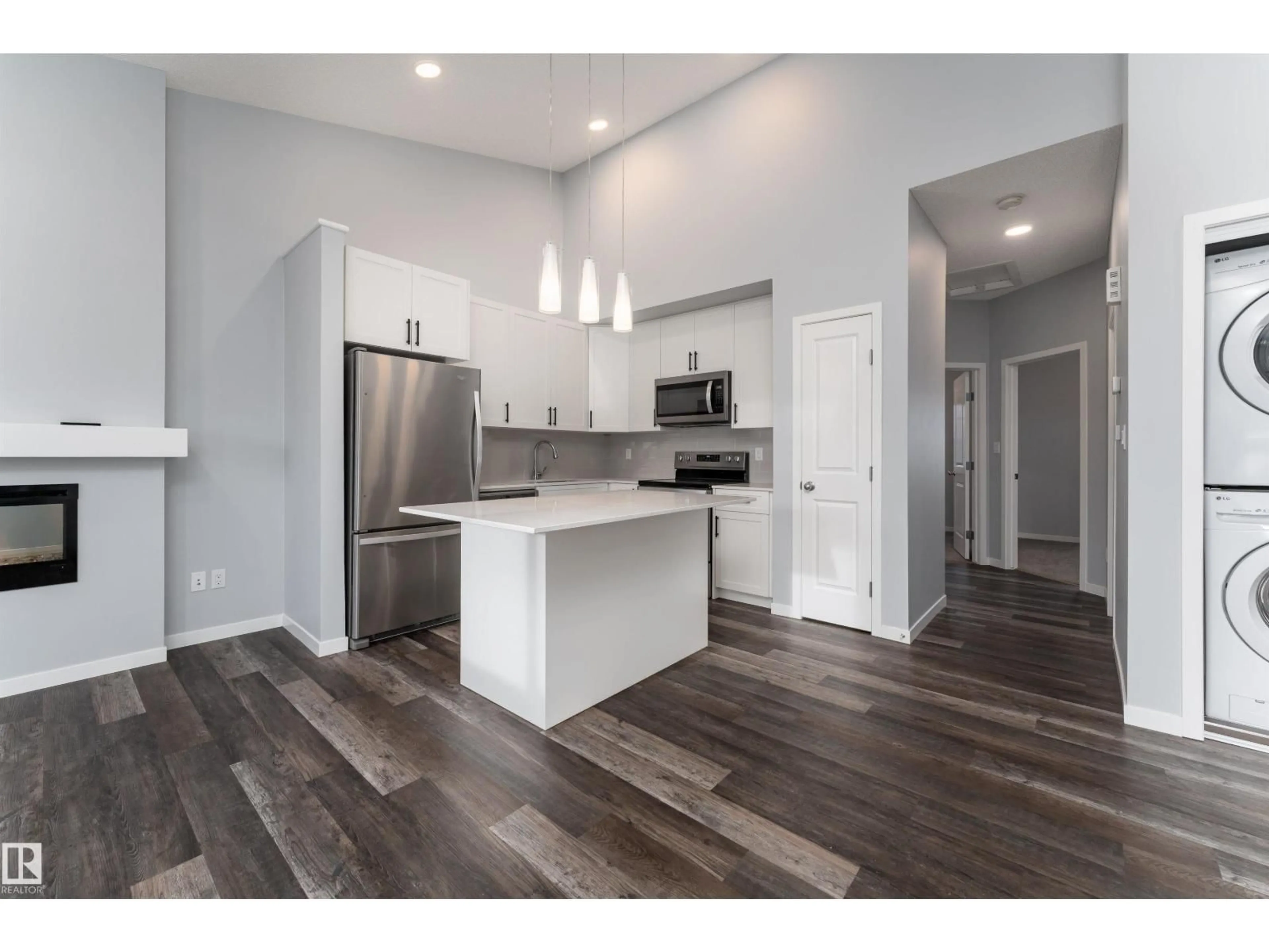 Open concept kitchen, wood/laminate floor for 56 - 3305 ORCHARDS LI, Edmonton Alberta T6X2H1