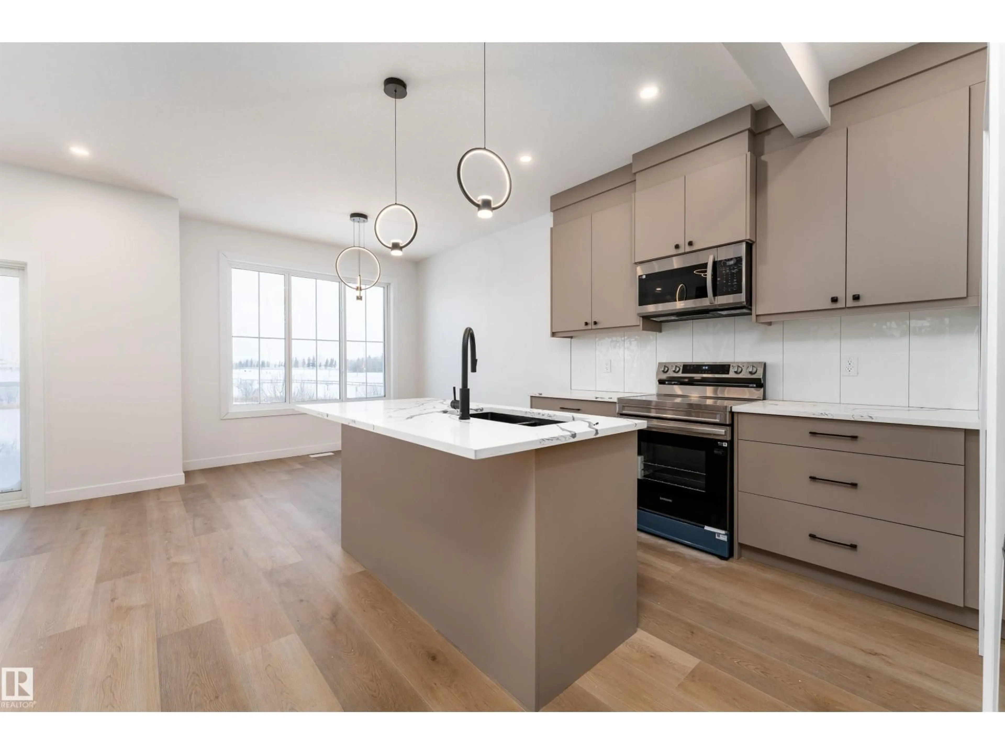 Open concept kitchen, wood/laminate floor for 186 ELLIOT WD, Fort Saskatchewan Alberta T8L1R8