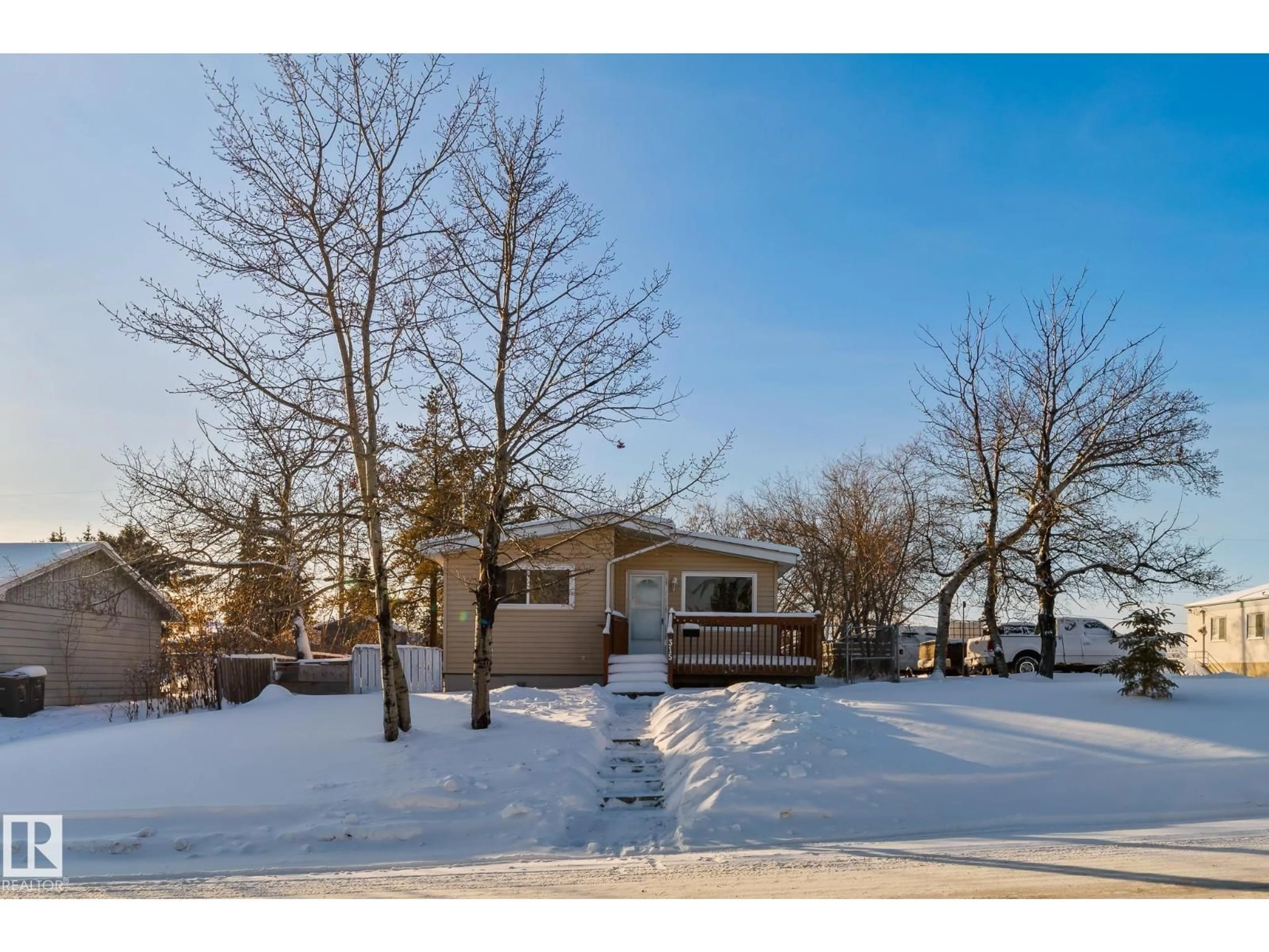 A pic from outside/outdoor area/front of a property/back of a property/a pic from drone, water/lake/river/ocean view for 315 10 ST, Cold Lake Alberta T9M1A5