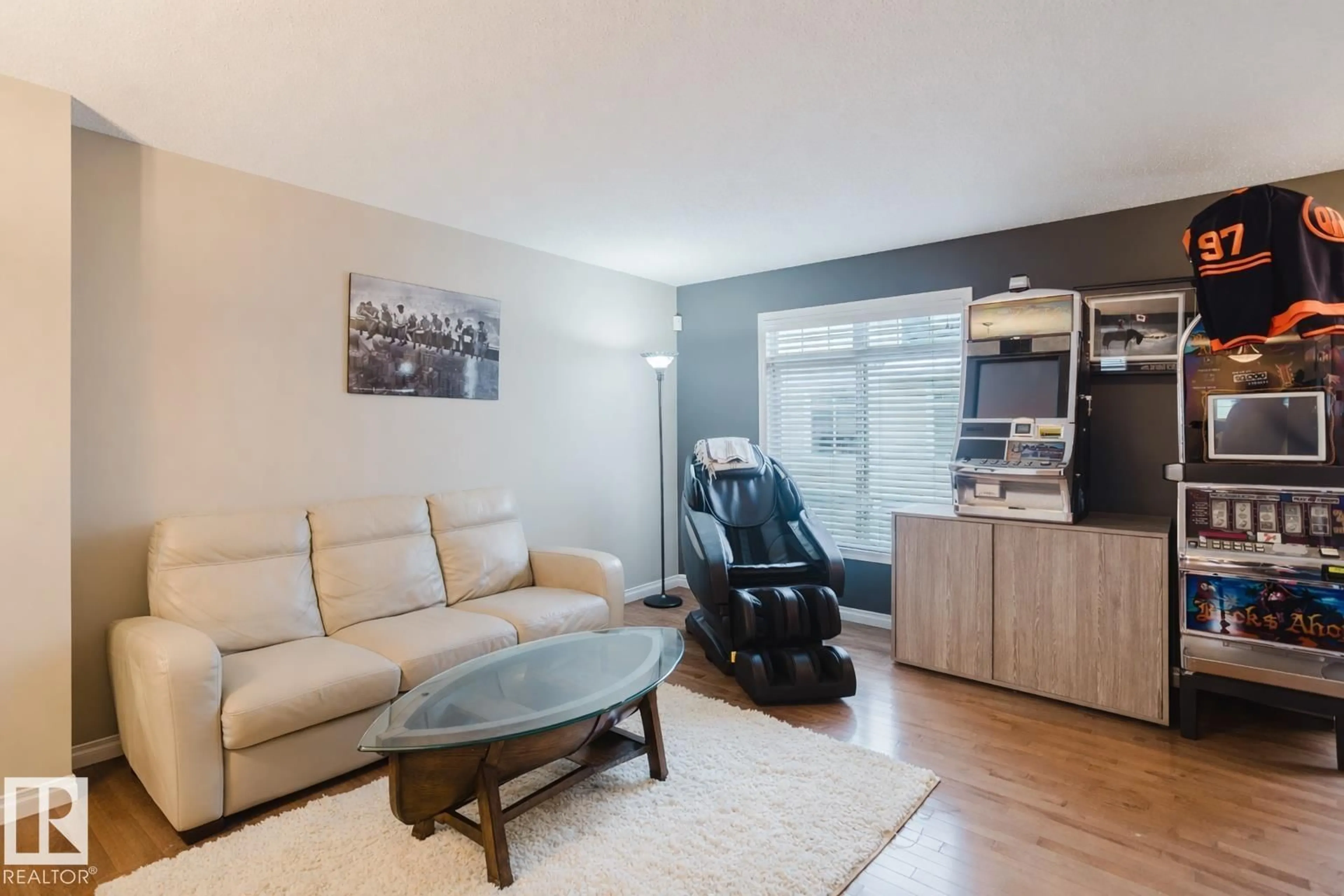 Living room with furniture, wood/laminate floor for 81 - 1804 70 ST, Edmonton Alberta T6X0H4