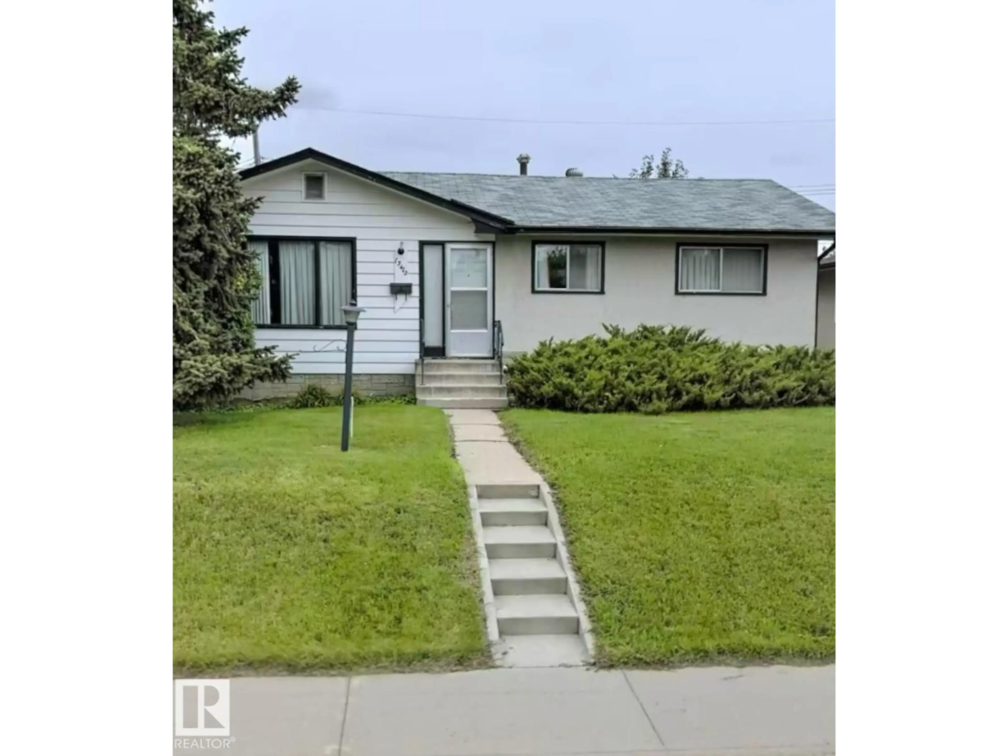 Home with vinyl exterior material, street for NW - 13412 113A ST, Edmonton Alberta T5E5C2