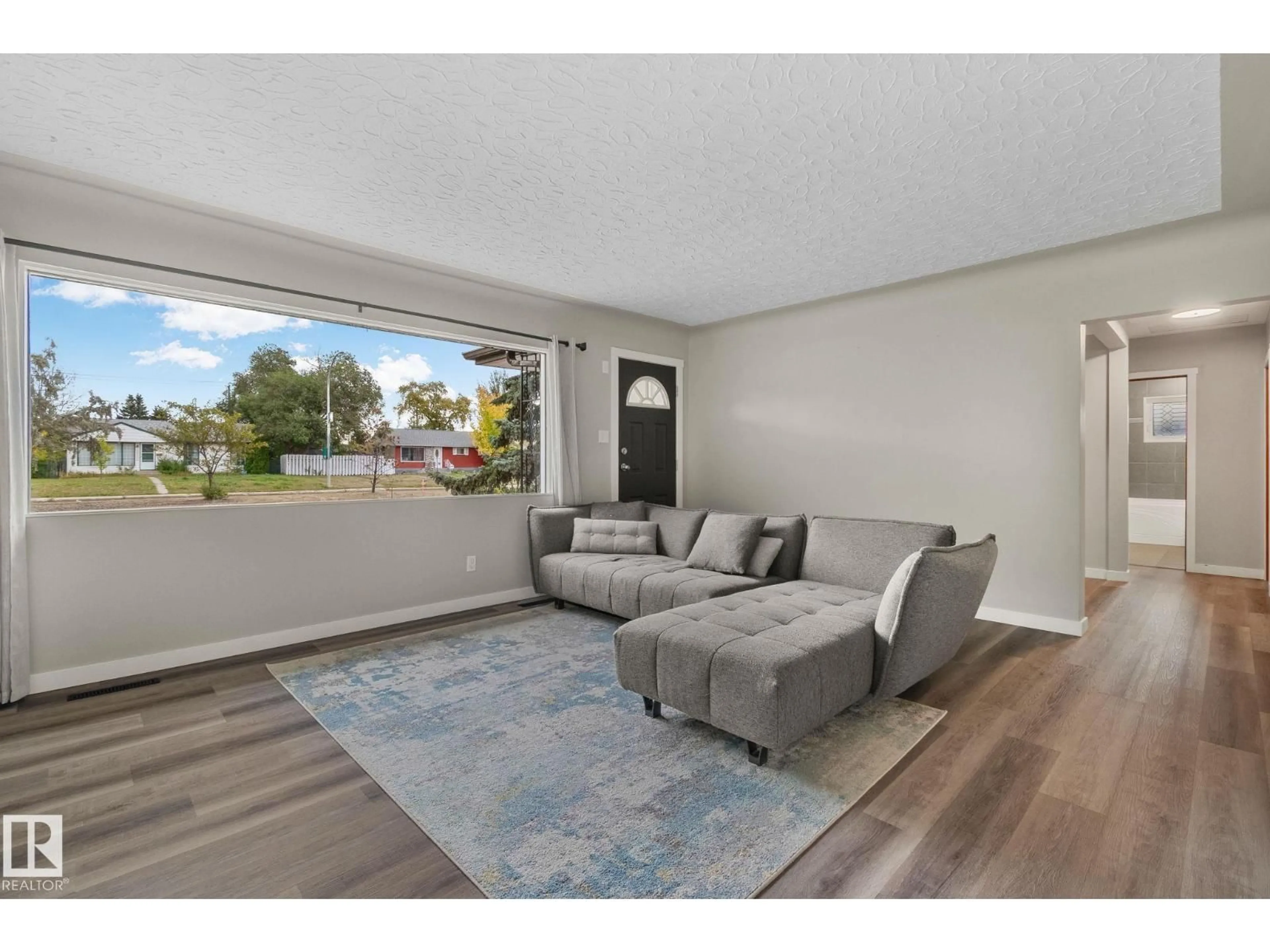 Living room with furniture, unknown for NW - 10324 50 ST, Edmonton Alberta T6A2C4