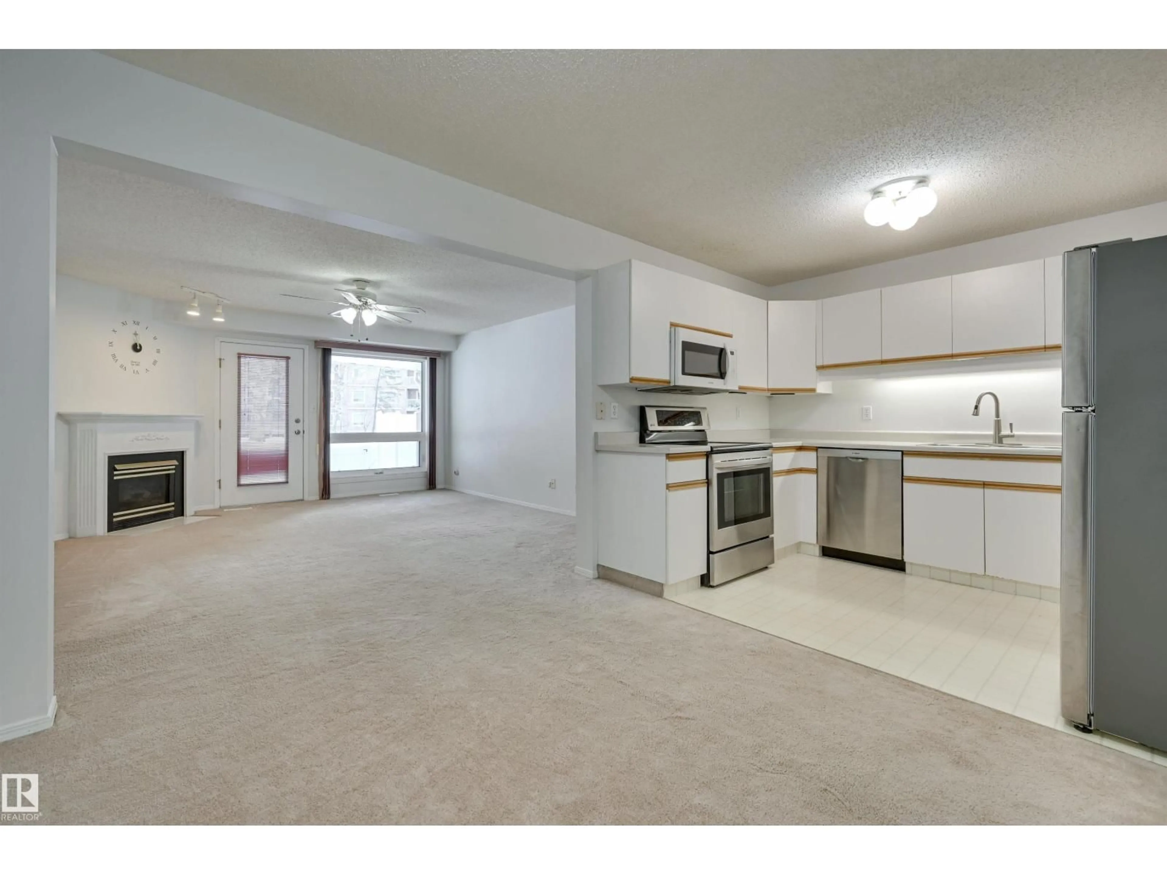Open concept kitchen, unknown for #107 - 8903 106A AV NW, Edmonton Alberta T5H3Y7