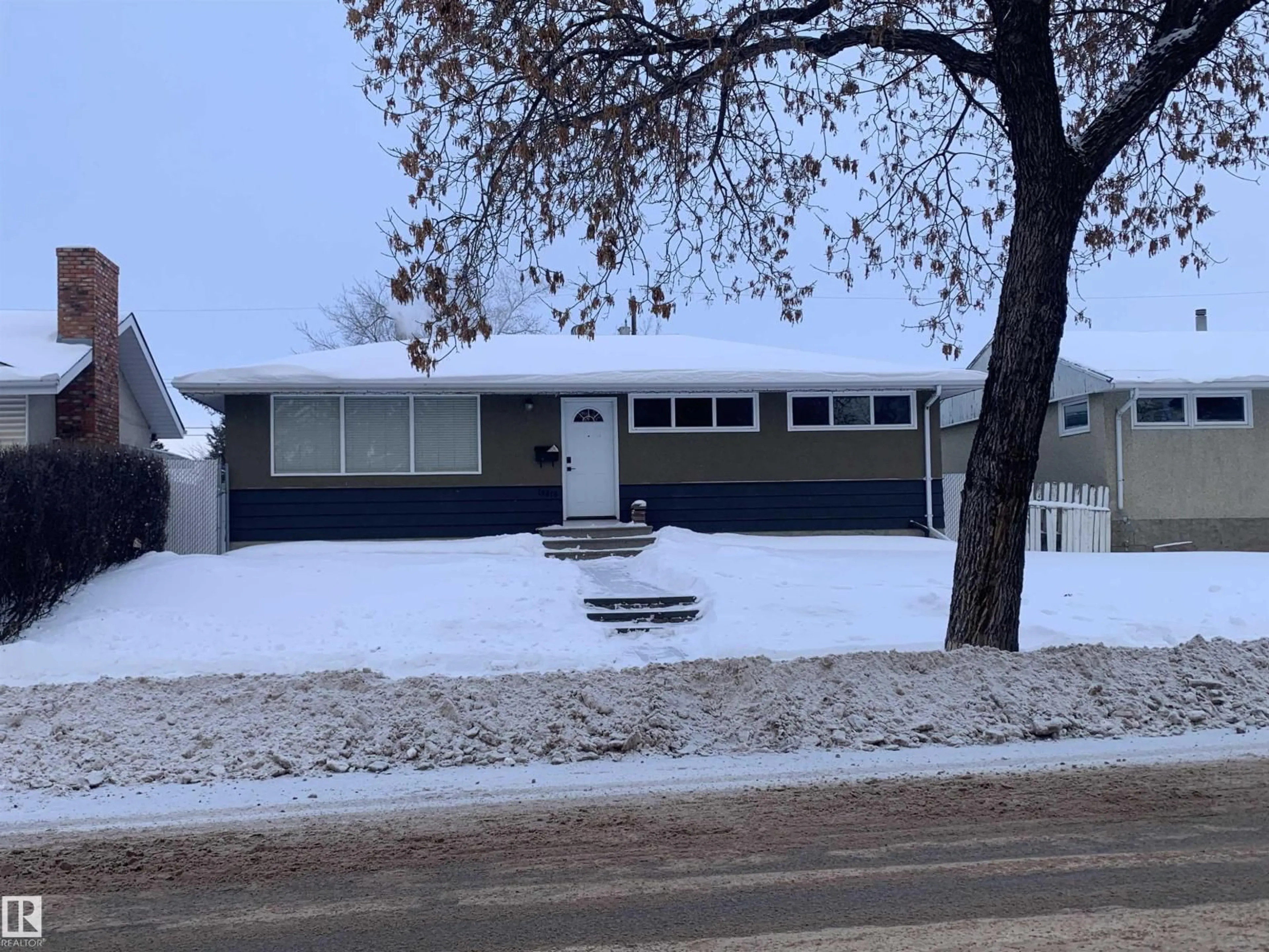 Home with vinyl exterior material, street for NW - 10816 163 ST, Edmonton Alberta T5P3P6
