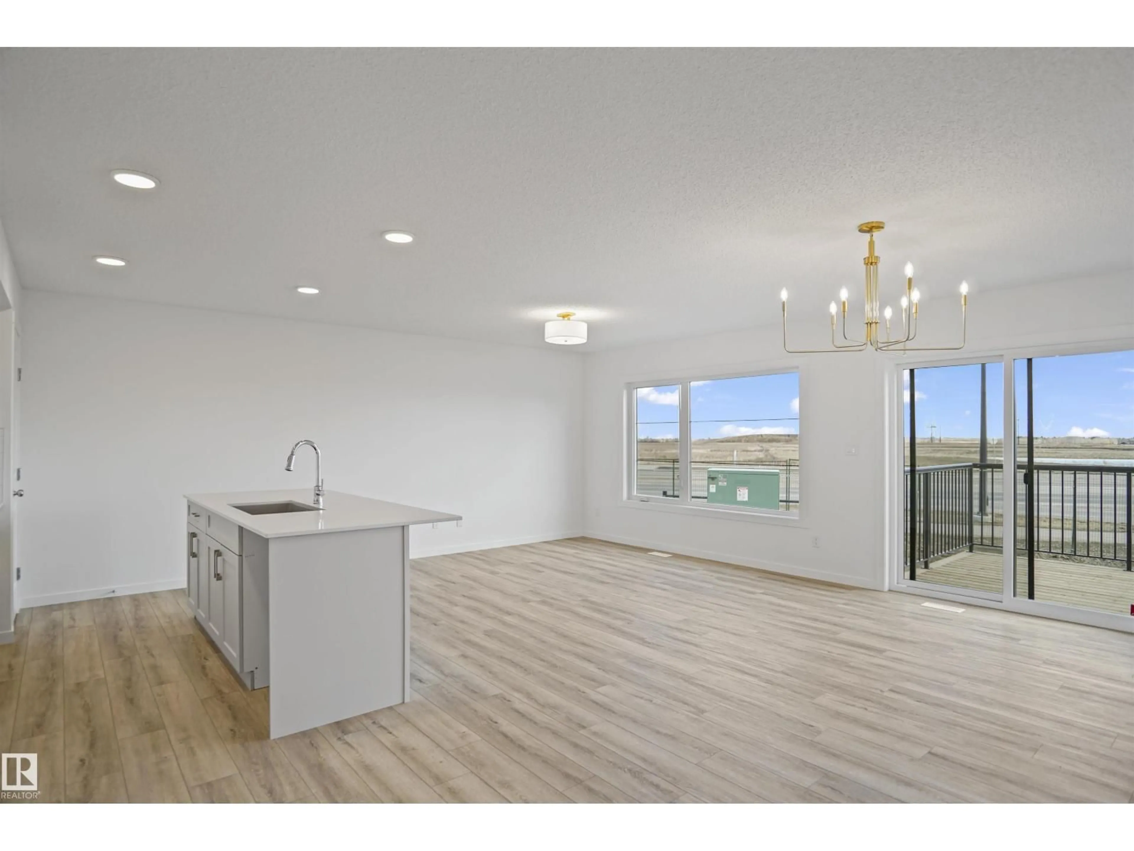 Open concept kitchen, wood/laminate floor for 58 19904 31 AV NW, Edmonton Alberta T6M1N7