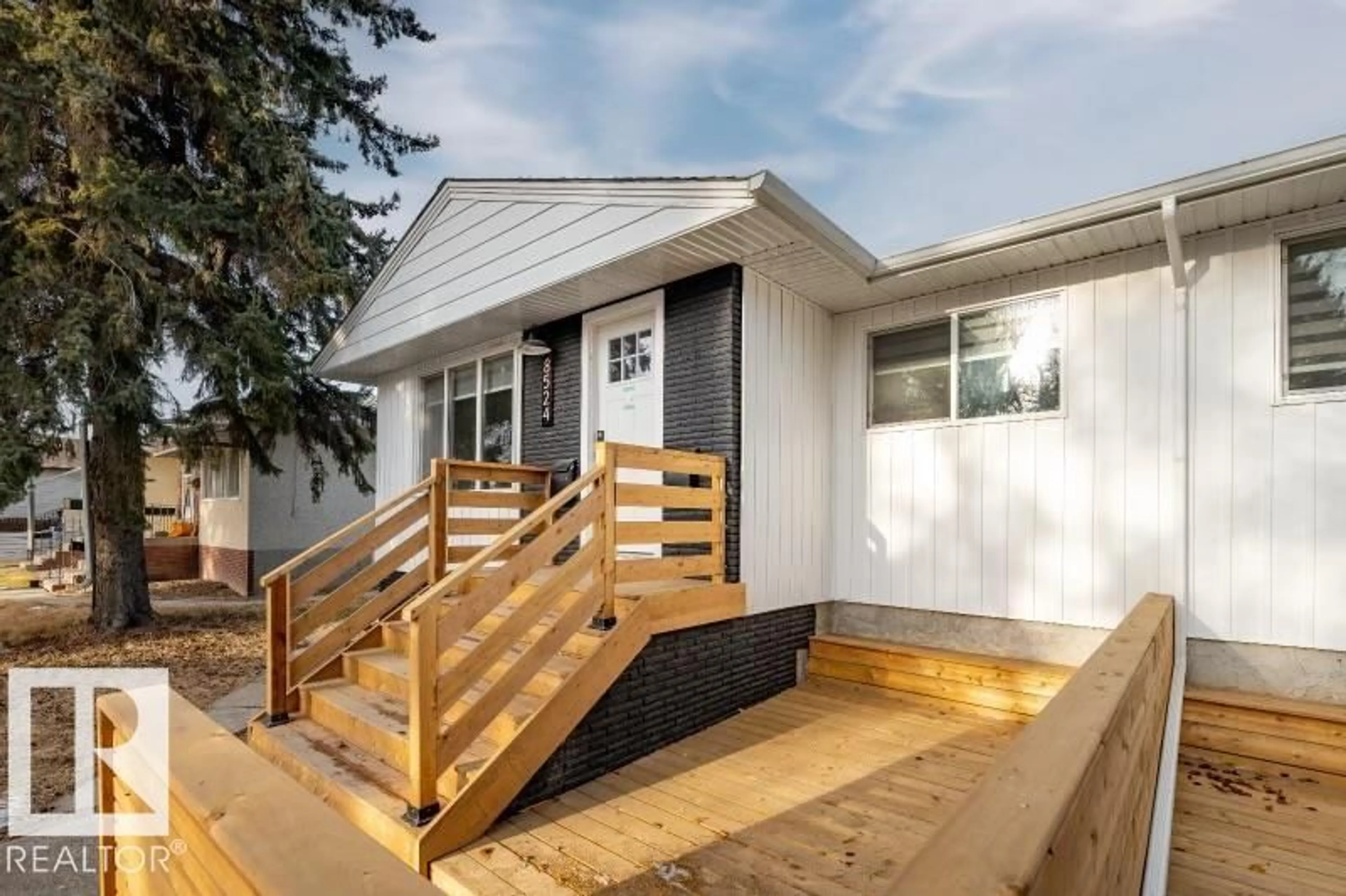 Home with vinyl exterior material, street for 8522/8524 84 AV, Edmonton Alberta T6C1C9