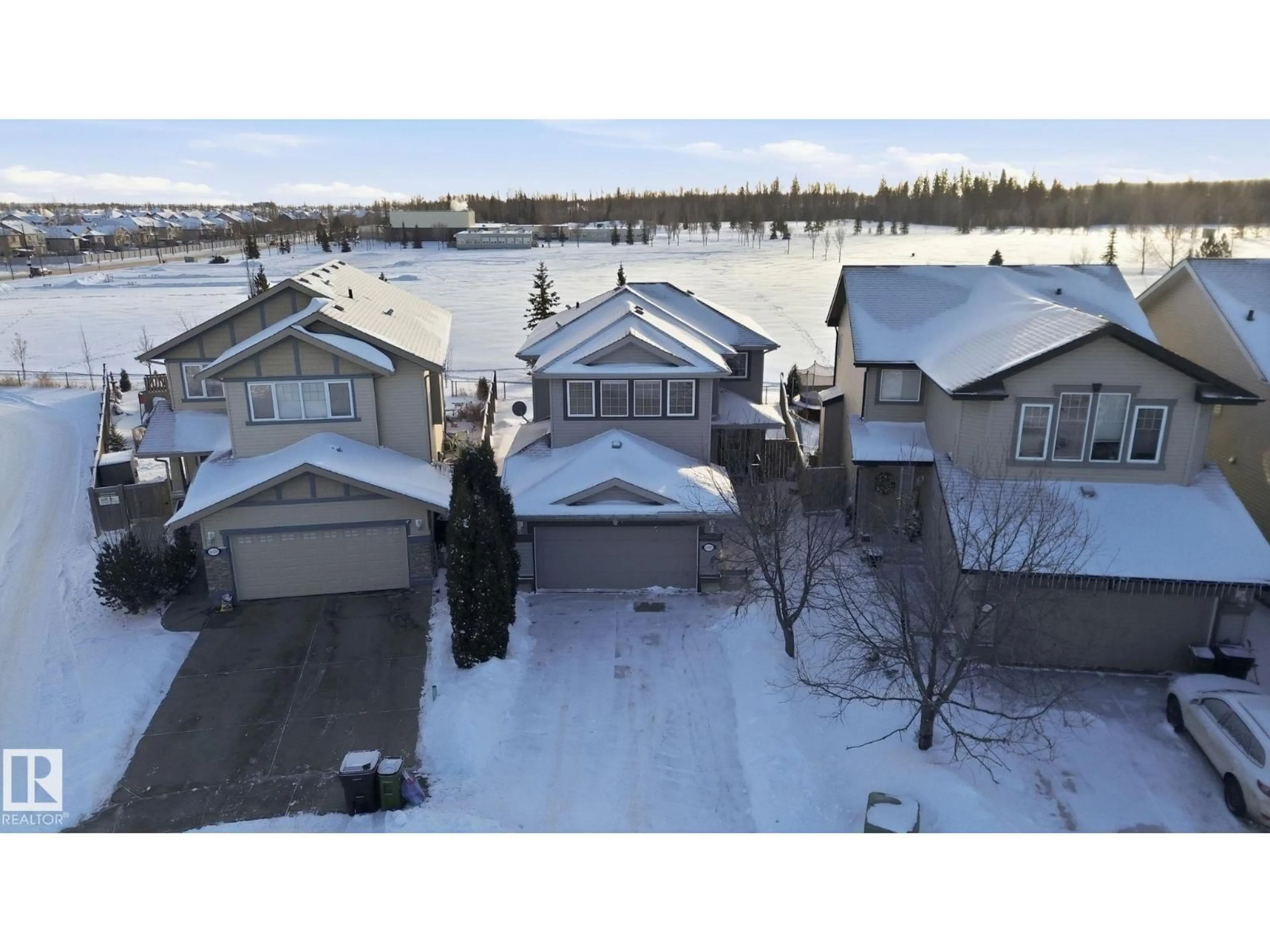 A pic from outside/outdoor area/front of a property/back of a property/a pic from drone, water/lake/river/ocean view for 21107 58 AV, Edmonton Alberta T6M0H3