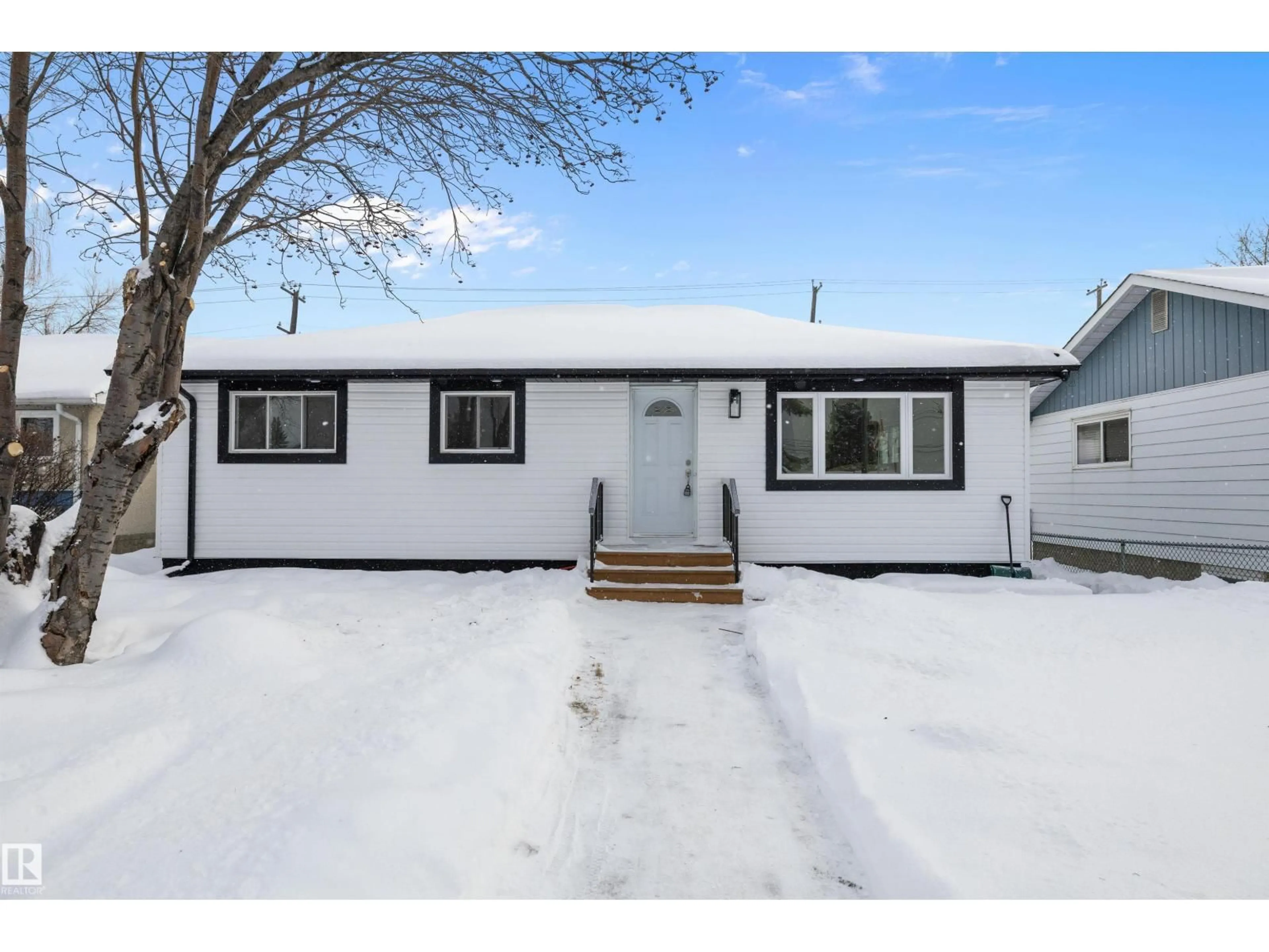 Home with vinyl exterior material, street for 13519 109 ST, Edmonton Alberta T6E4Y6