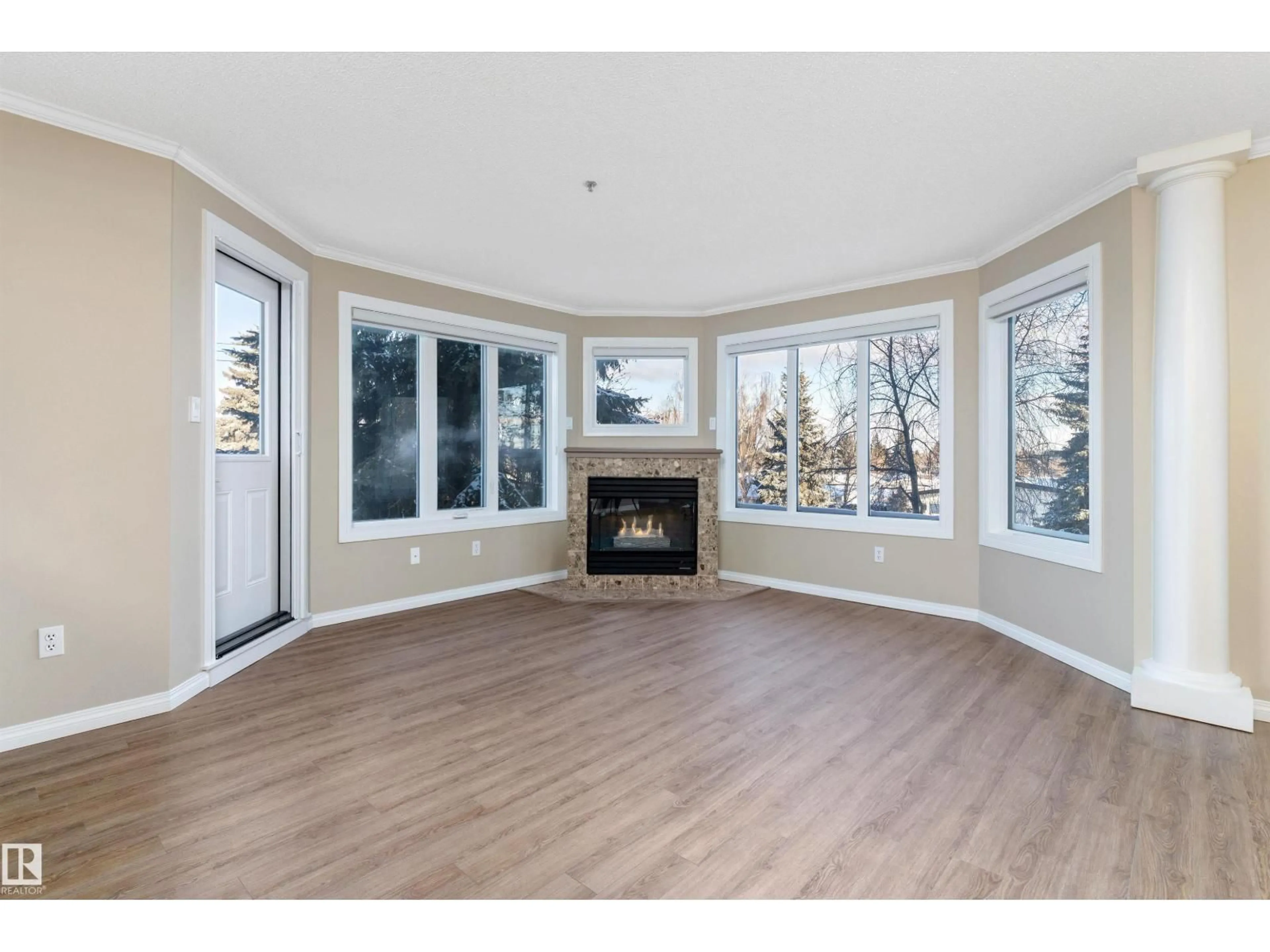 Living room with furniture, wood/laminate floor for 203 - 10610 76 ST, Edmonton Alberta T6A3Y9