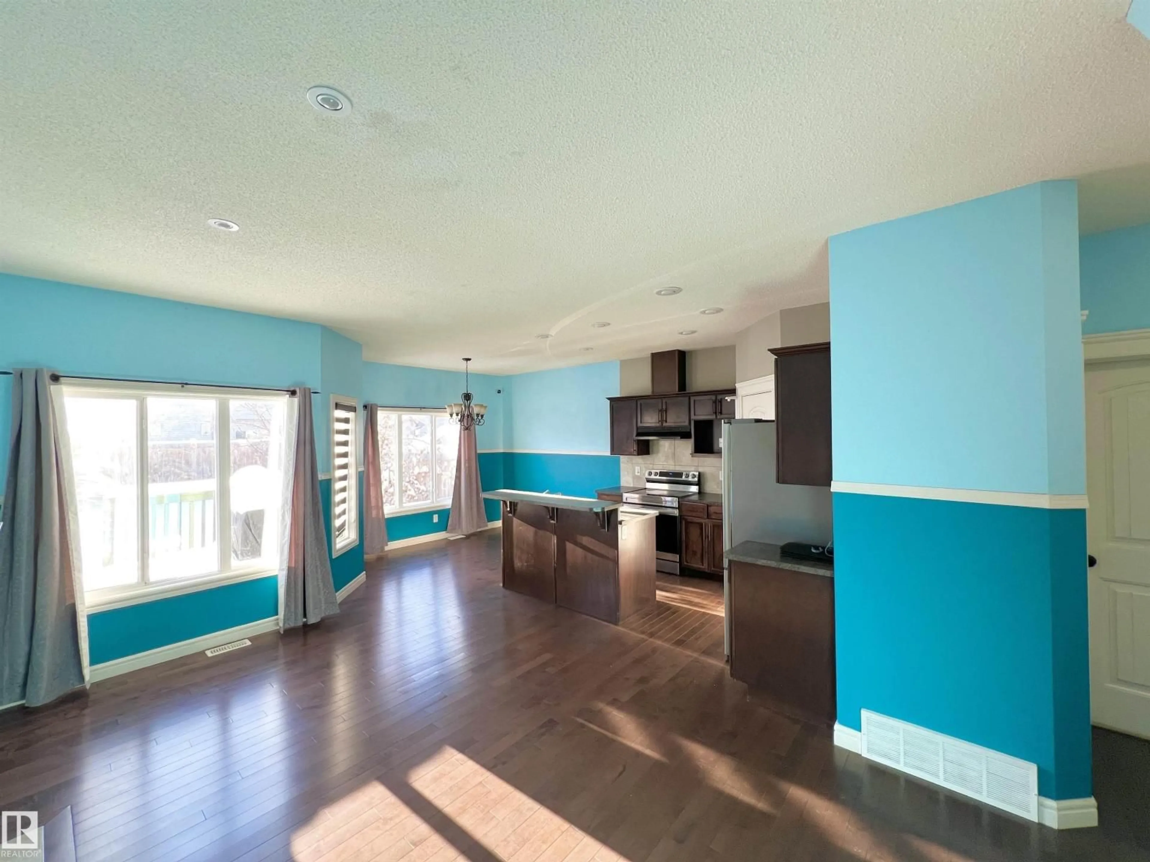 Open concept kitchen, wood/laminate floor for 2825 16A AV, Edmonton Alberta T6O0S7