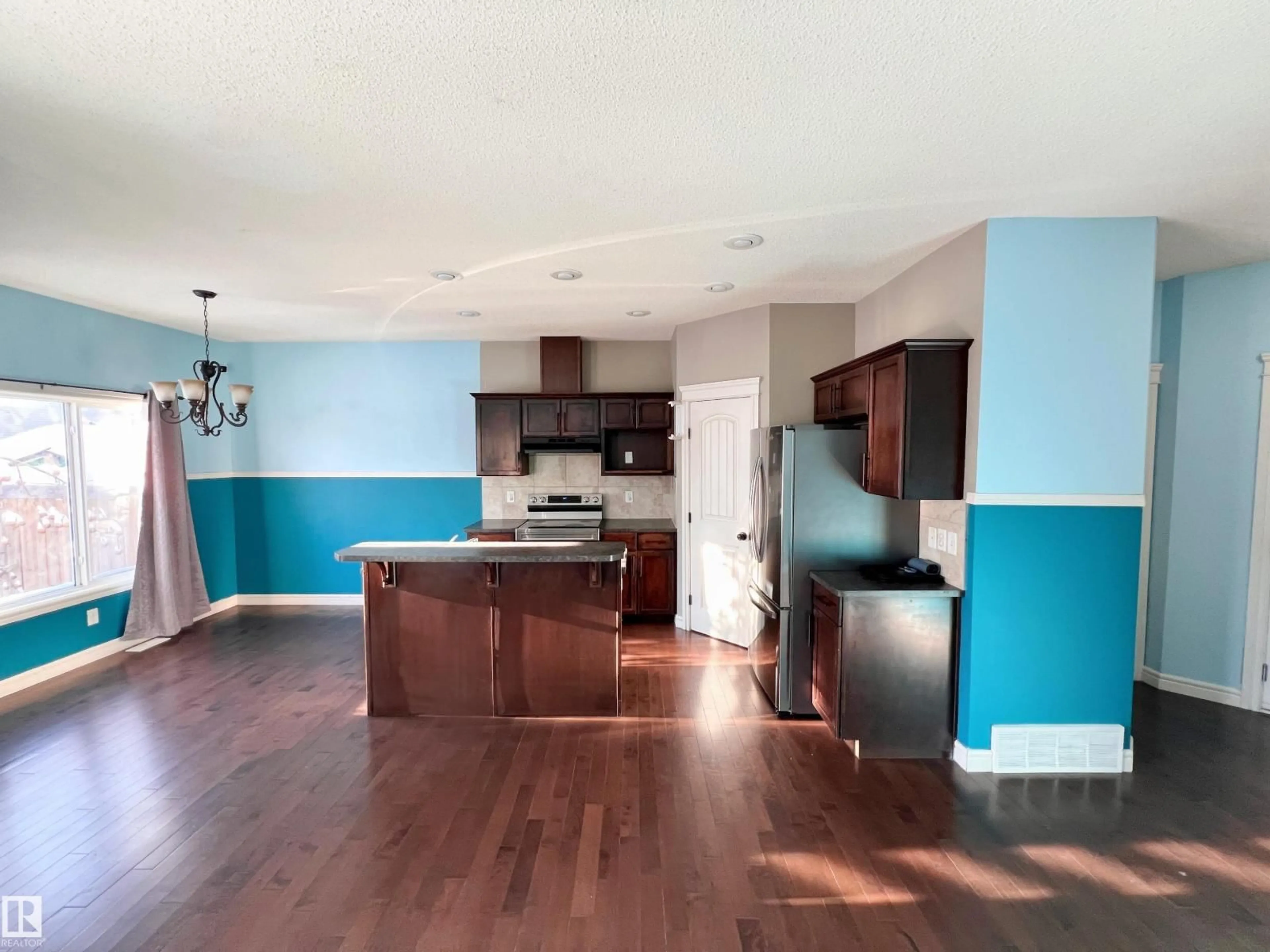 Open concept kitchen, wood/laminate floor for 2825 16A AV, Edmonton Alberta T6O0S7