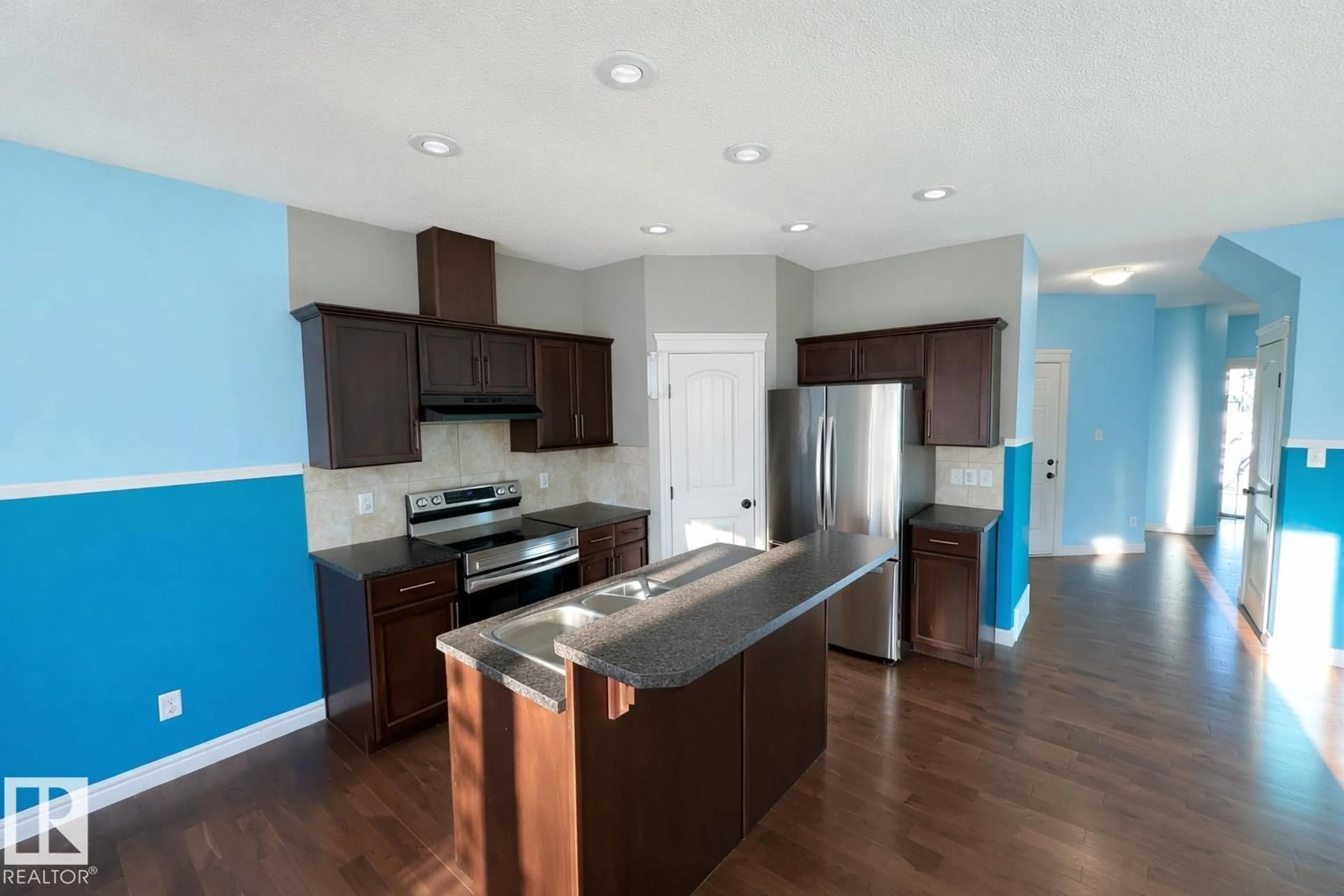 Open concept kitchen, wood/laminate floor for 2825 16A AV, Edmonton Alberta T6O0S7