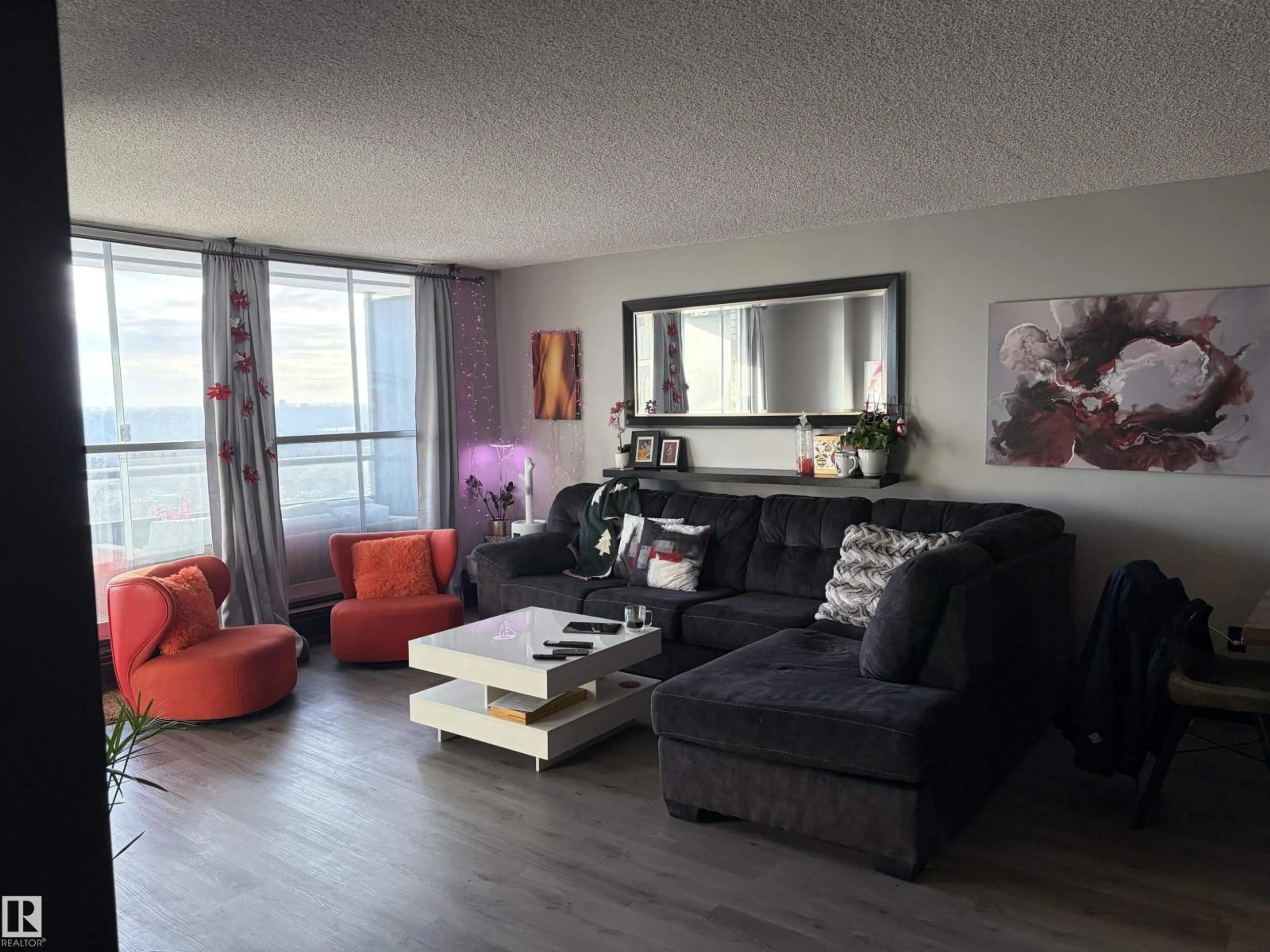 Living room with furniture, wood/laminate floor for 1314 STONY PLAIN RD, Edmonton Alberta T5N3R2