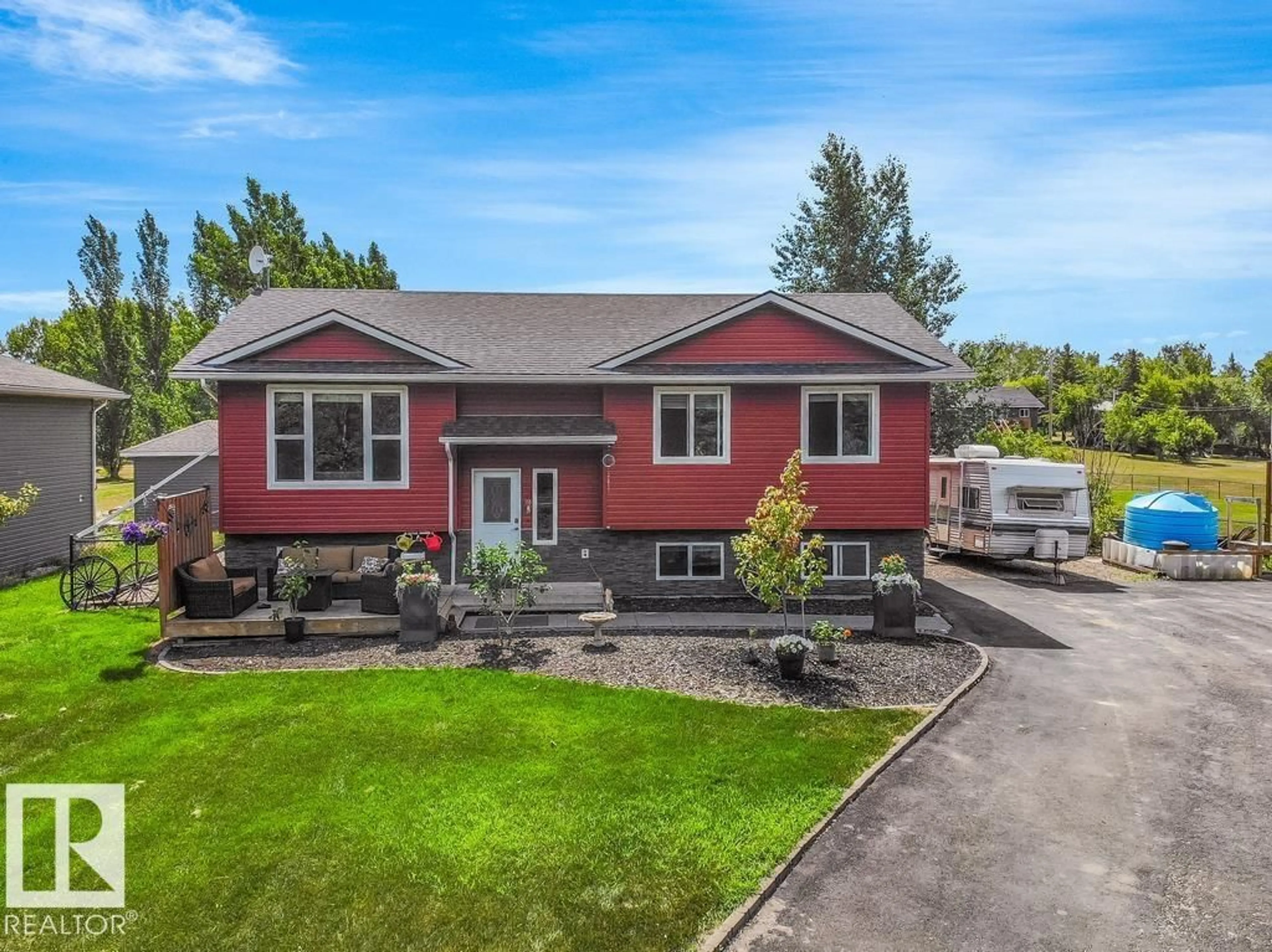 Home with vinyl exterior material, street for 46410 - 446 TWP RD 610, Rural Bonnyville M.D. Alberta T9N1J6